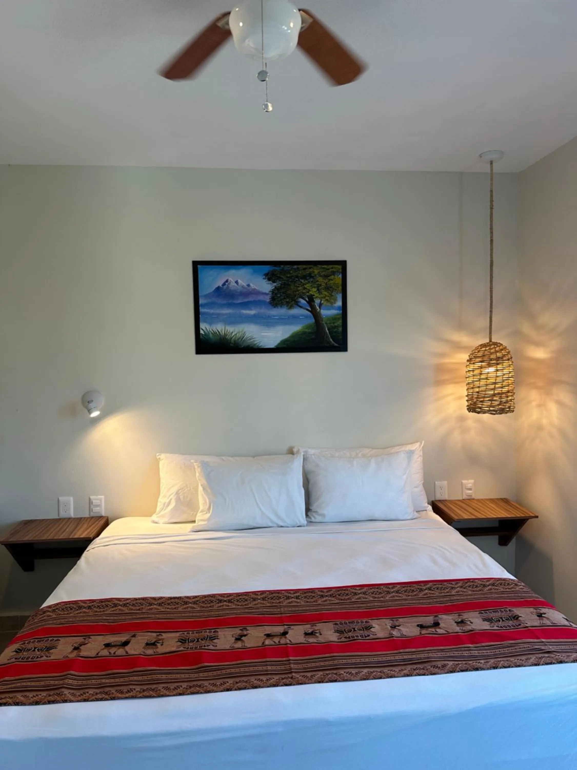 Bed in Oneiro Suites with Sea View