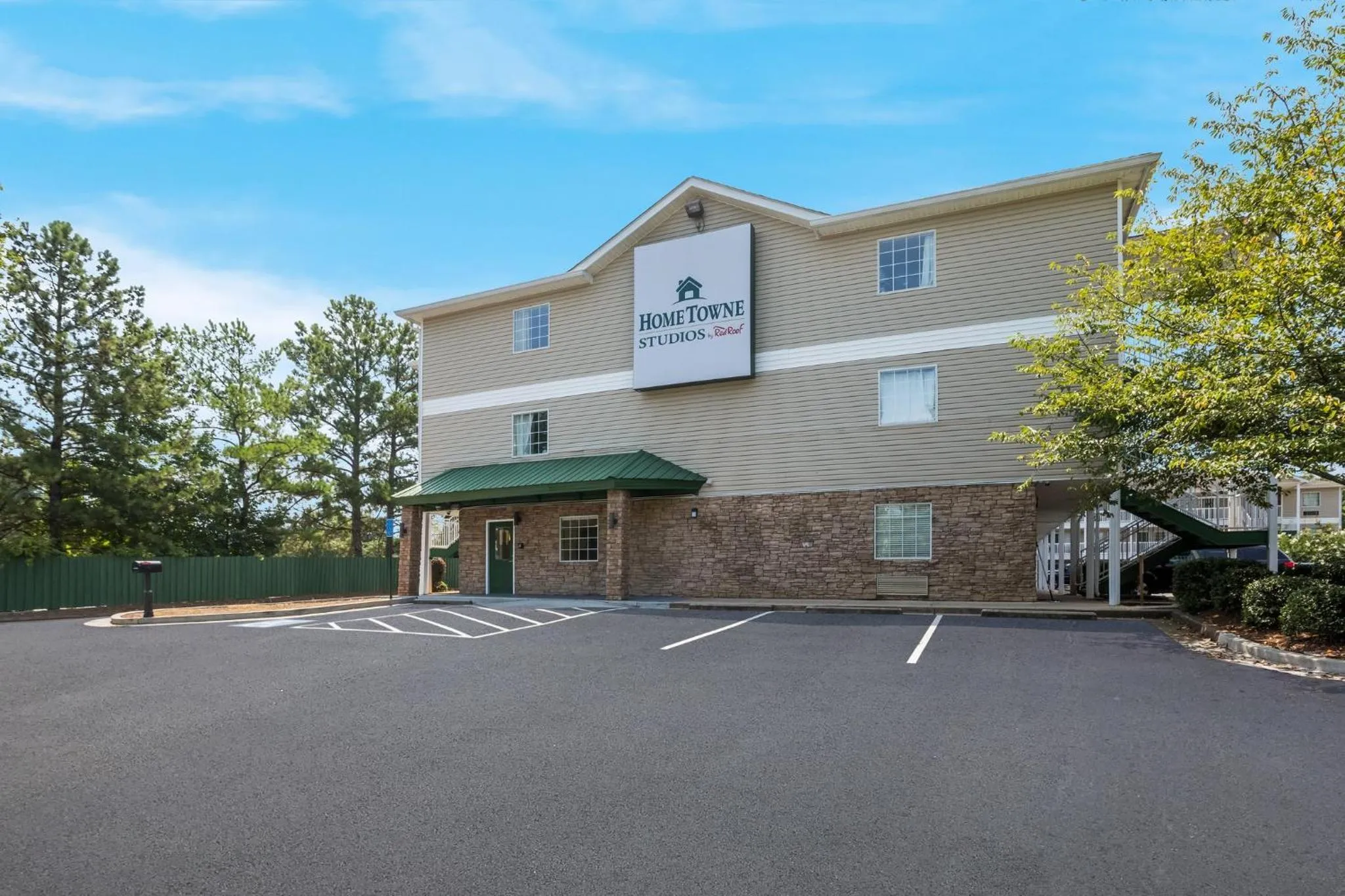 Property building in HomeTowne Studios by Red Roof Covington, GA