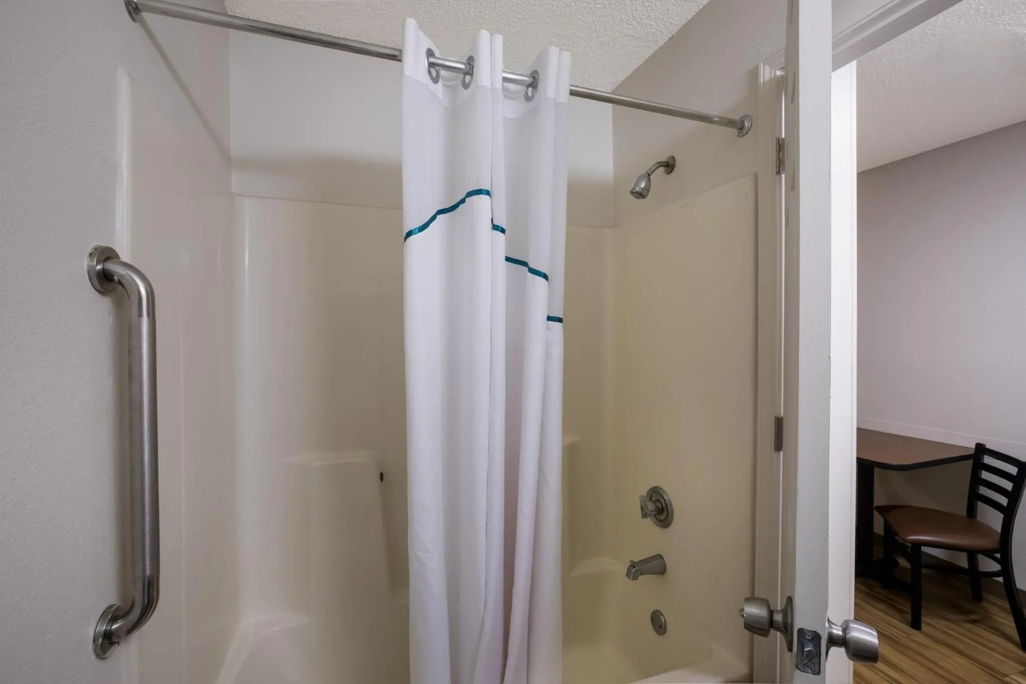 Bathroom in HomeTowne Studios by Red Roof Covington, GA