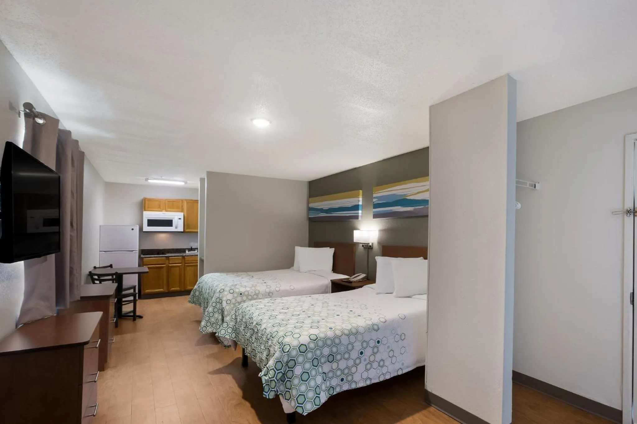 Photo of the whole room, Bed in HomeTowne Studios by Red Roof Covington, GA