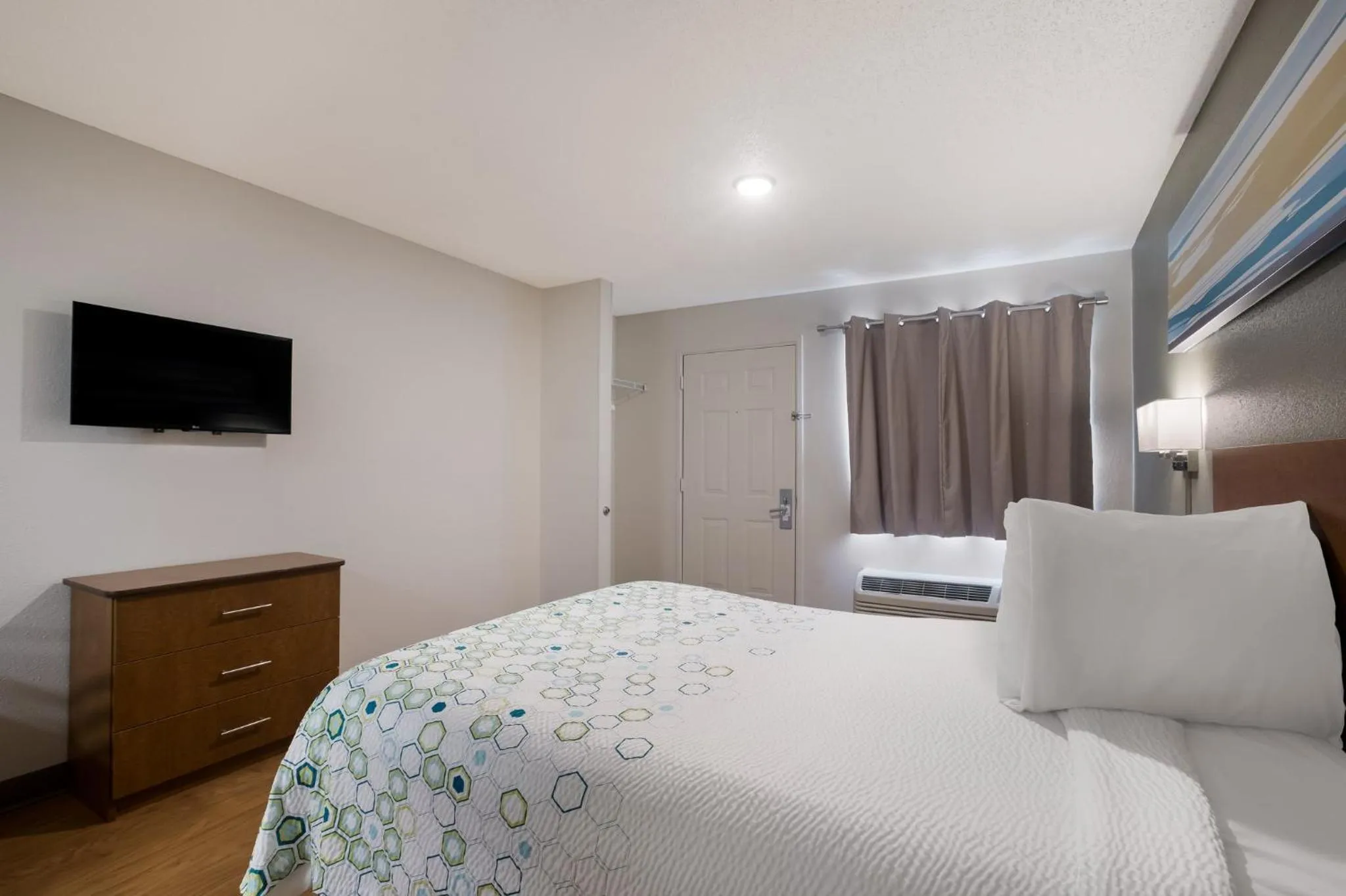 Bedroom, Bed in HomeTowne Studios by Red Roof Covington, GA