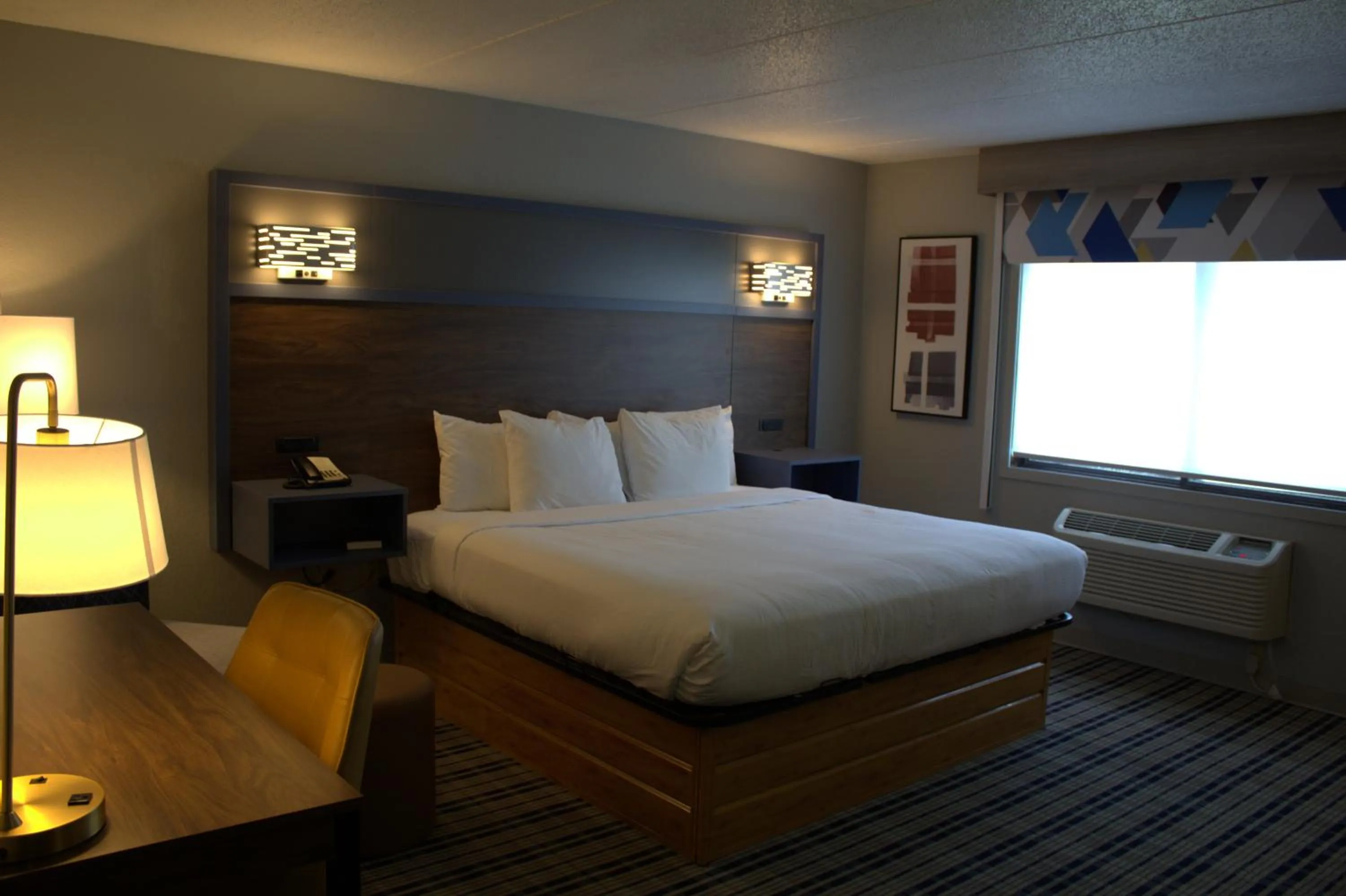Bed in AmericInn by Wyndham Worthington
