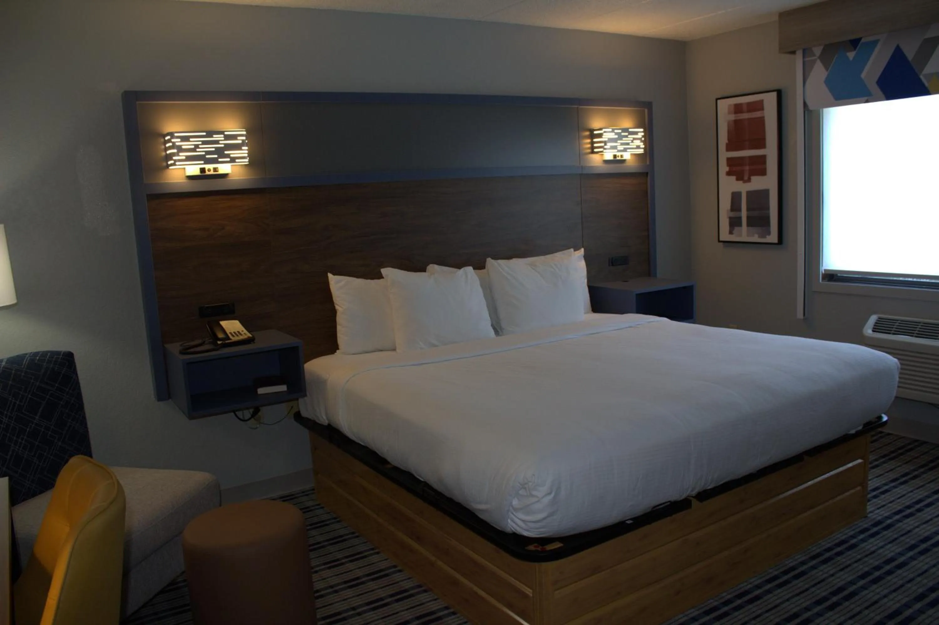 Bed in AmericInn by Wyndham Worthington