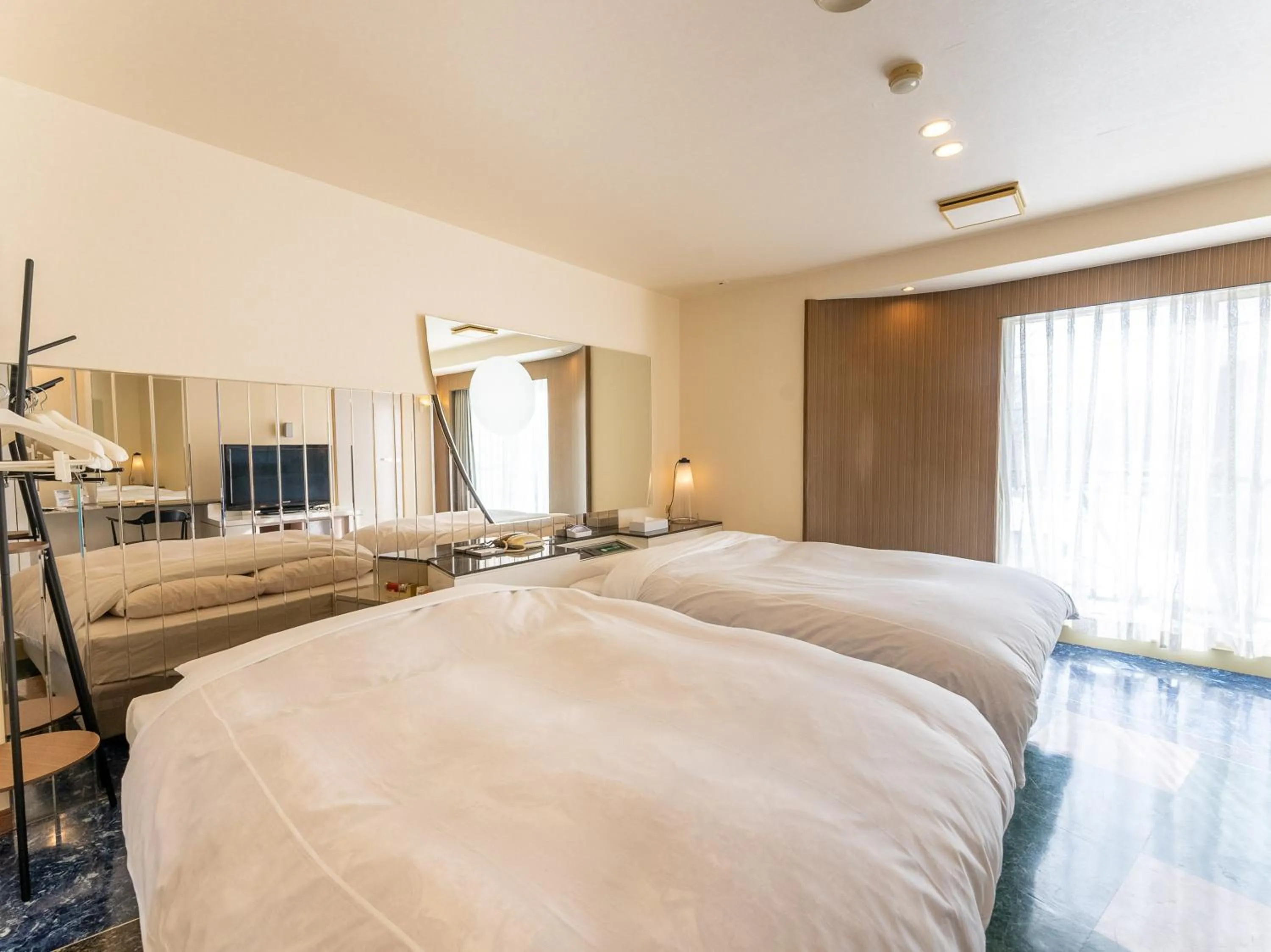 Bed in Tabist Shizukuishi Resort Hotel