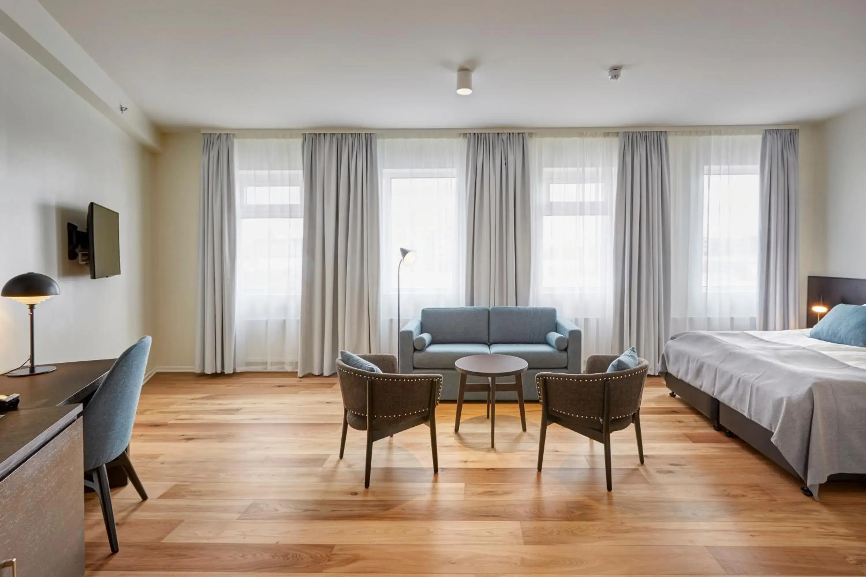 Seating area, Bed in Fosshotel Reykjavík Seating area, Bed in Fosshotel Reykjavík