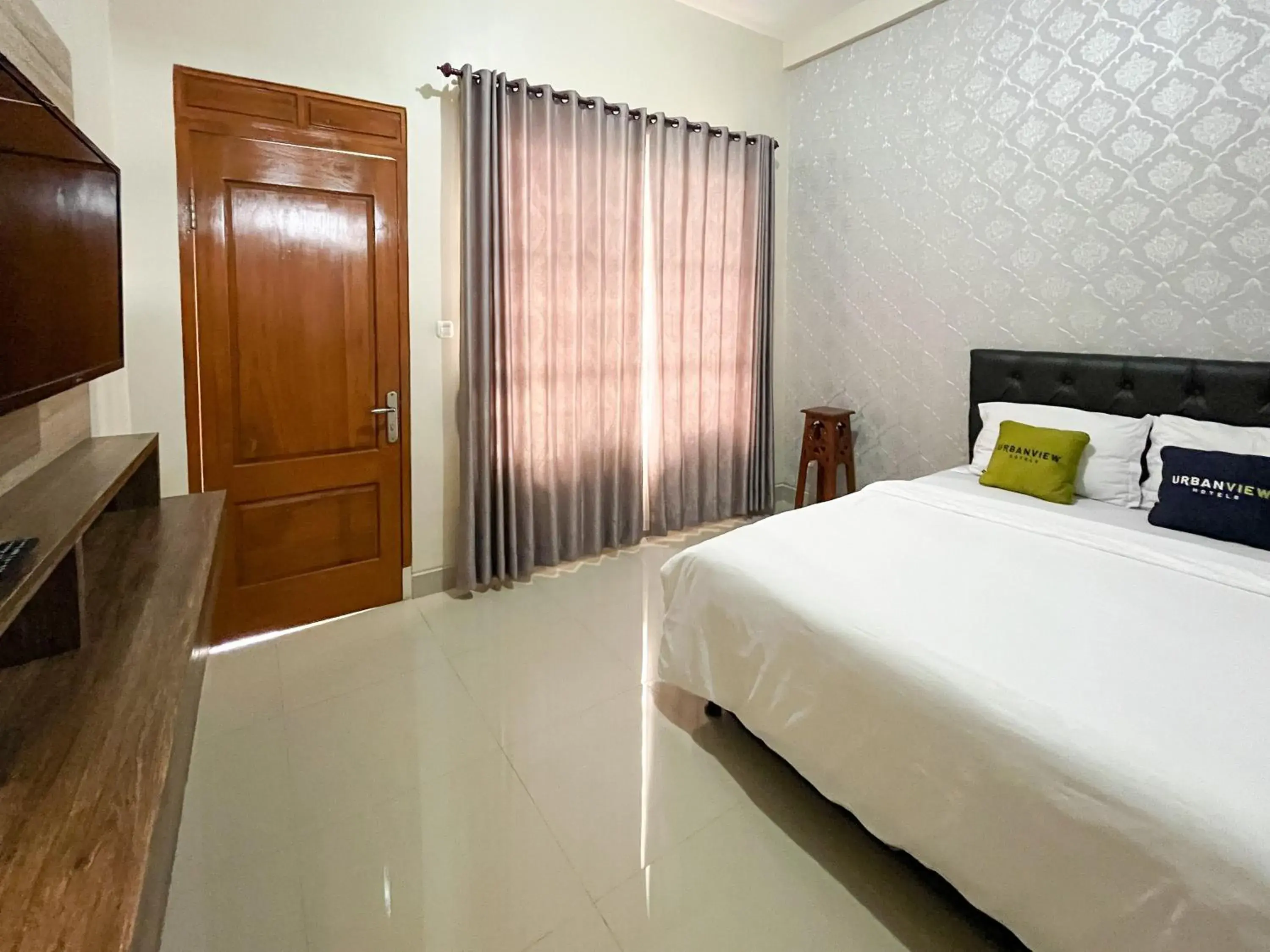 Bed in Urbanview Syariah Hotel Kanigara Batu Bed in Urbanview Syariah Hotel Kanigara Batu