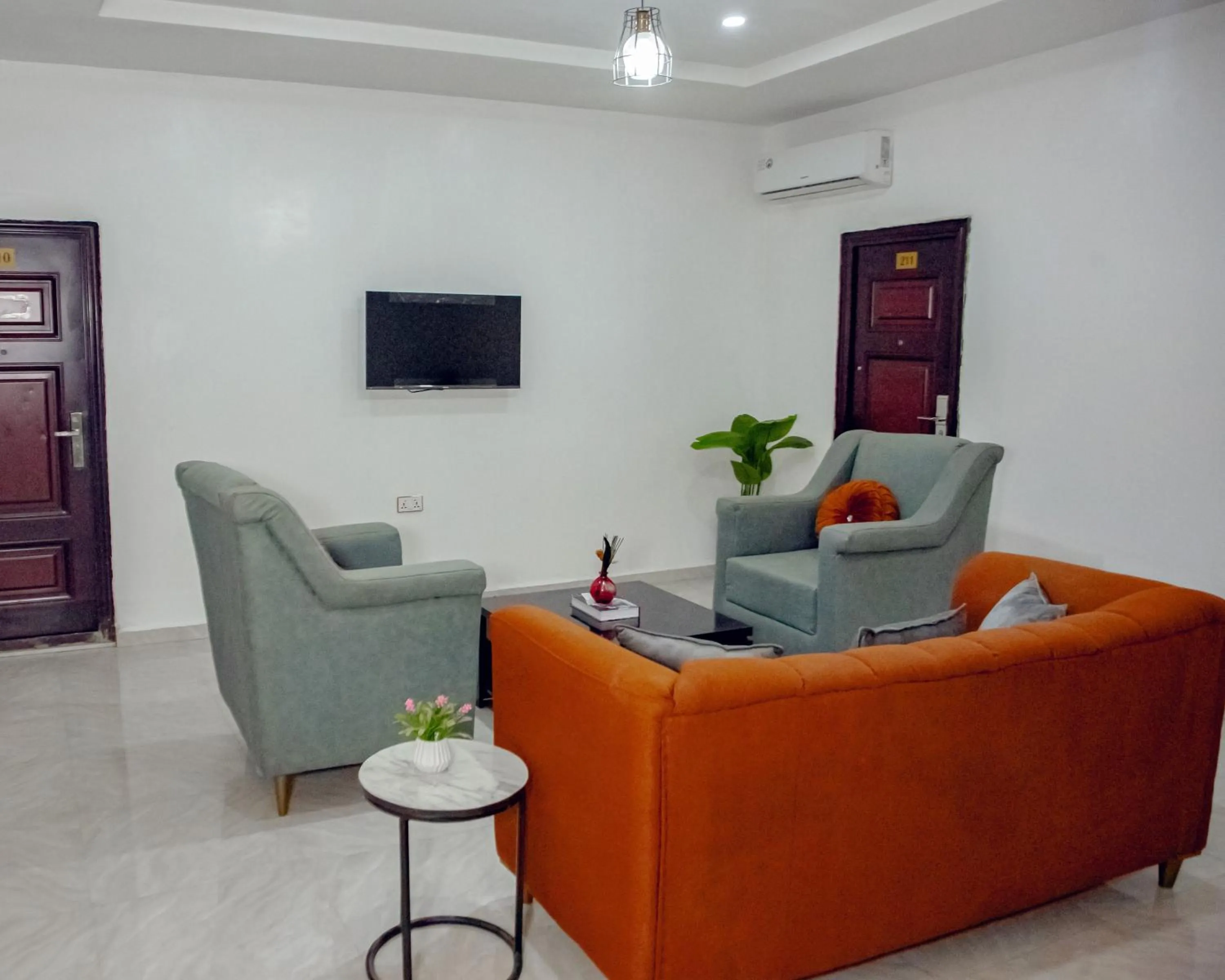 Communal lounge/ TV room in Nexus Xpress Hotel