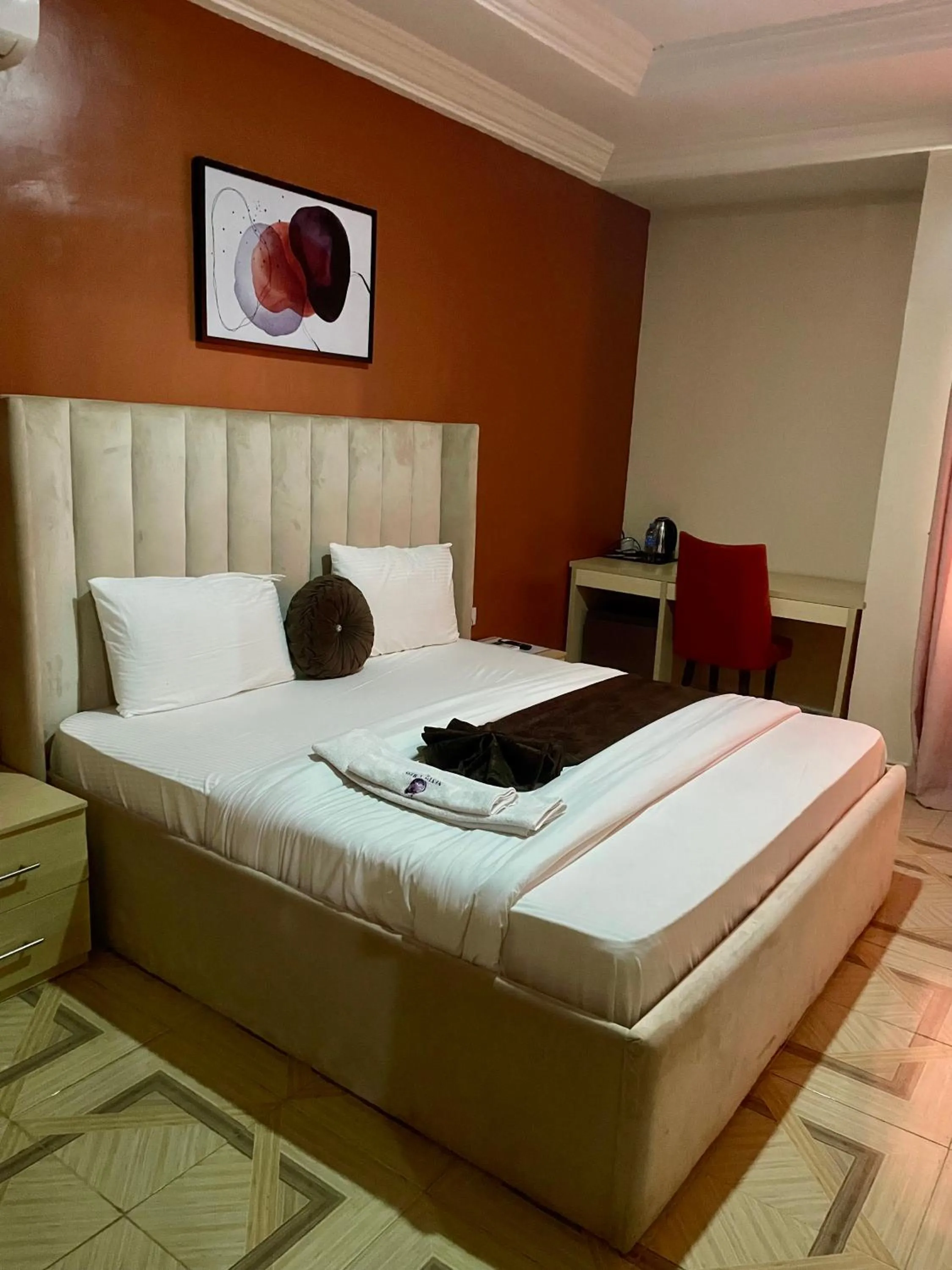 Bed in Nexus Xpress Hotel