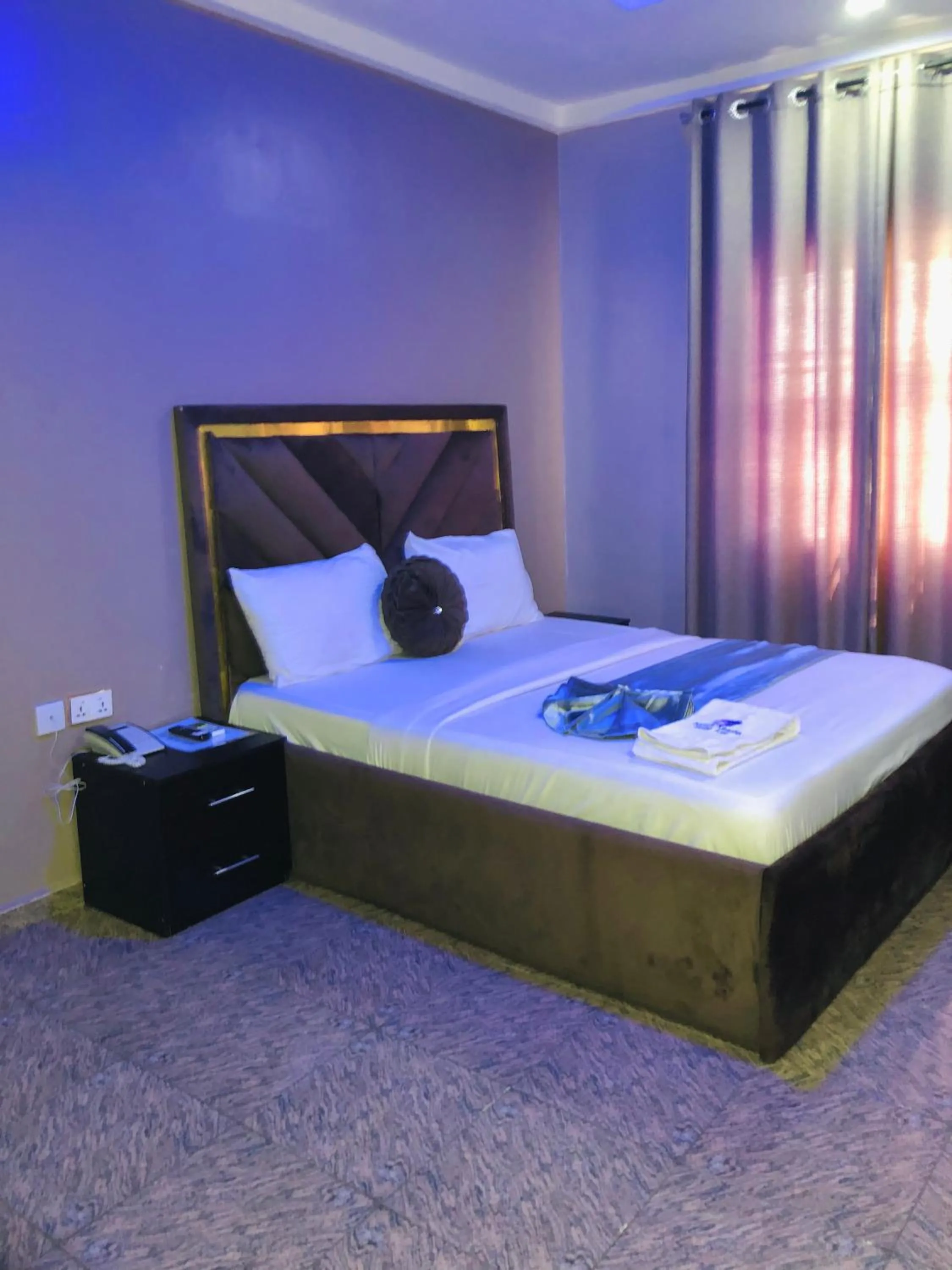 Bed in Nexus Xpress Hotel