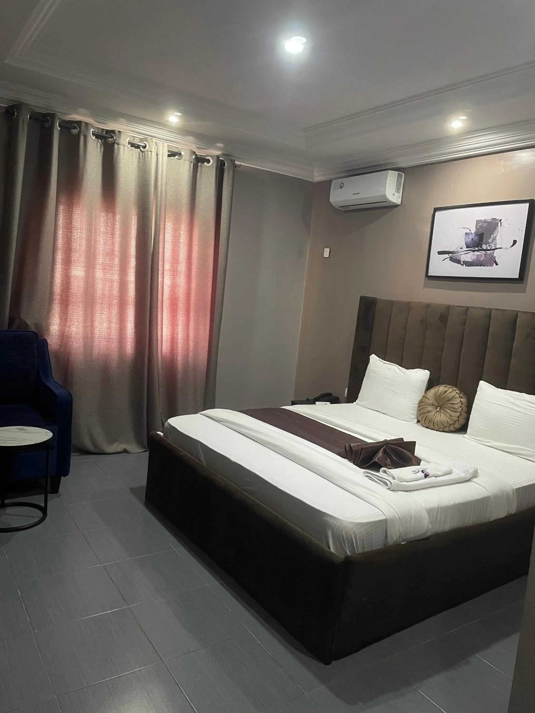 Living room, Bed in Nexus Xpress Hotel