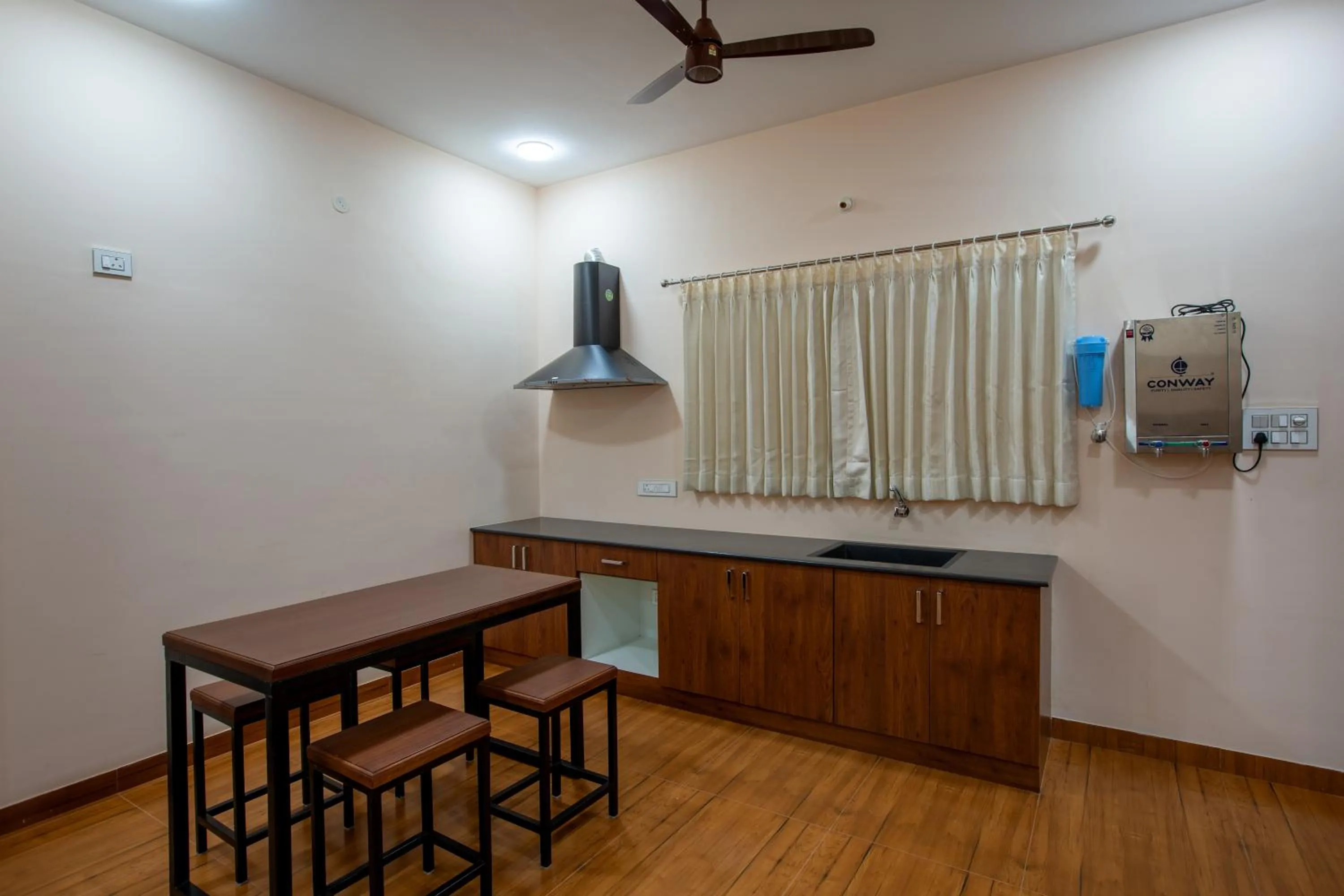 Kitchen or kitchenette in MUGUNDAN 'S SMART STAY