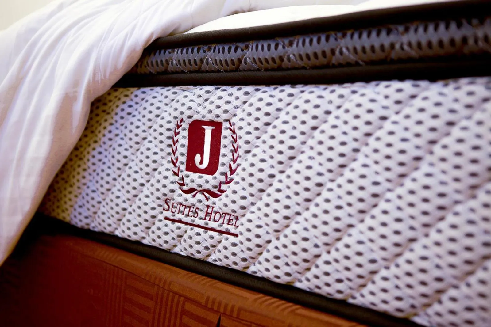 Bed in J Suites Hotel