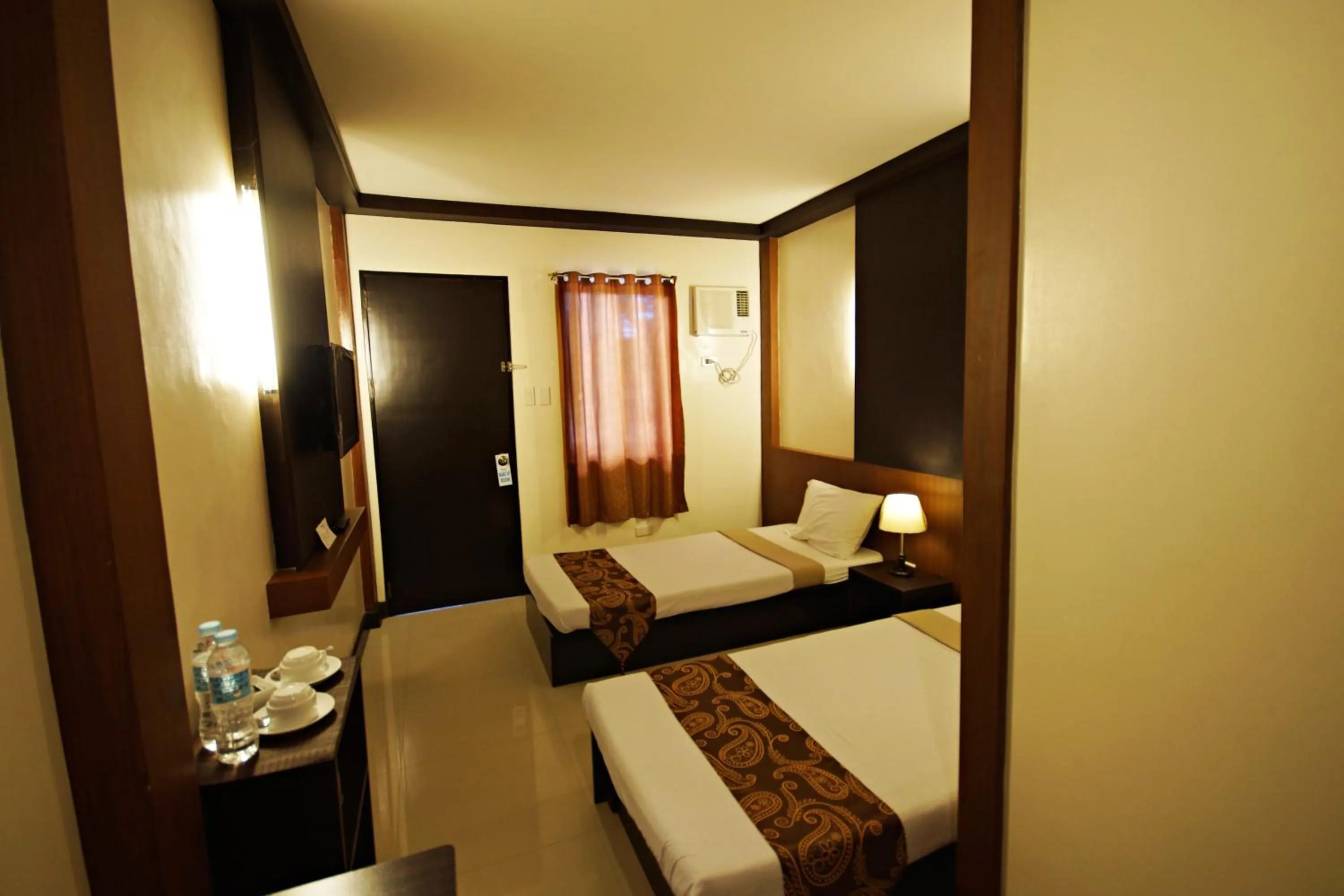 Photo of the whole room, Bed in Pacific Palm Suites Davao powered by Cocotel