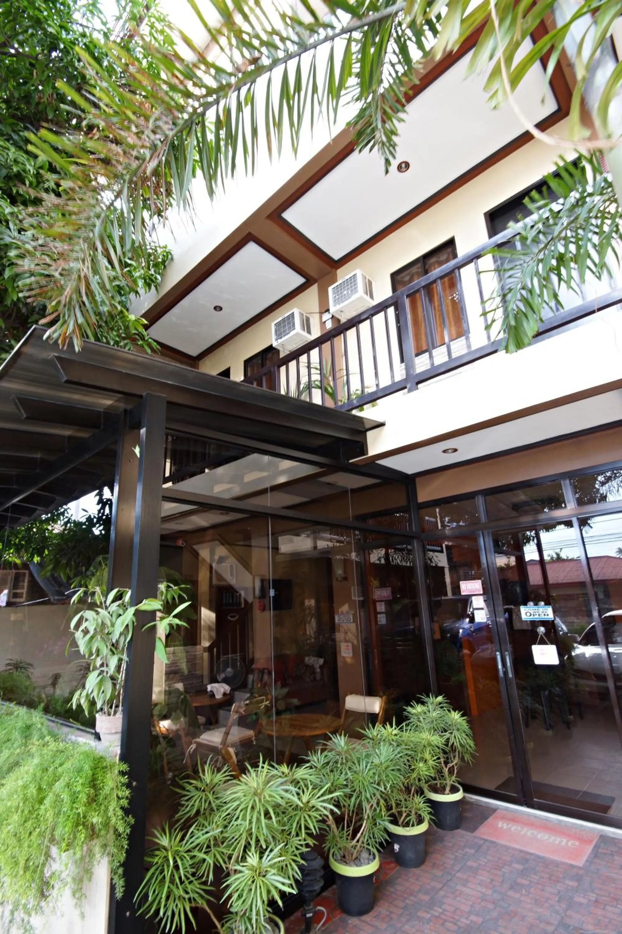 Facade/entrance in Pacific Palm Suites Davao powered by Cocotel