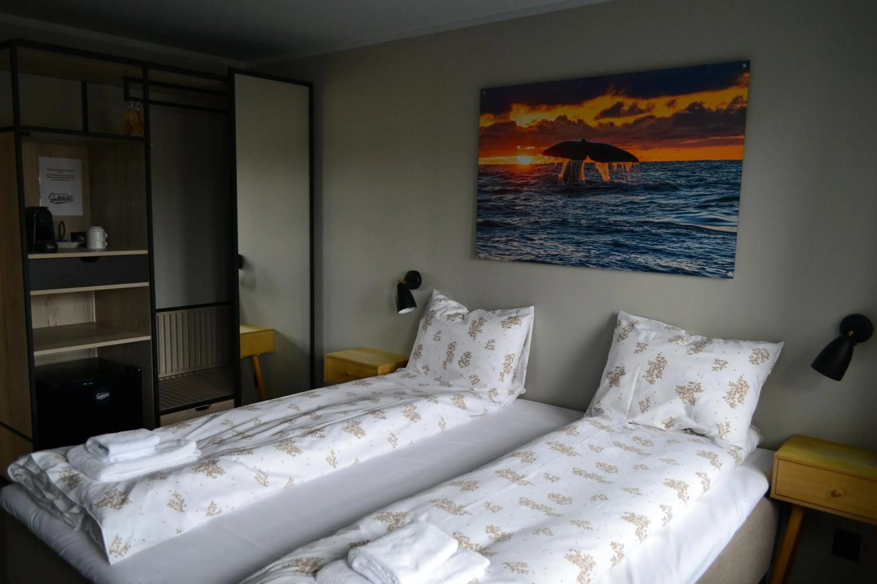 Bed in Andenes Suitehotel