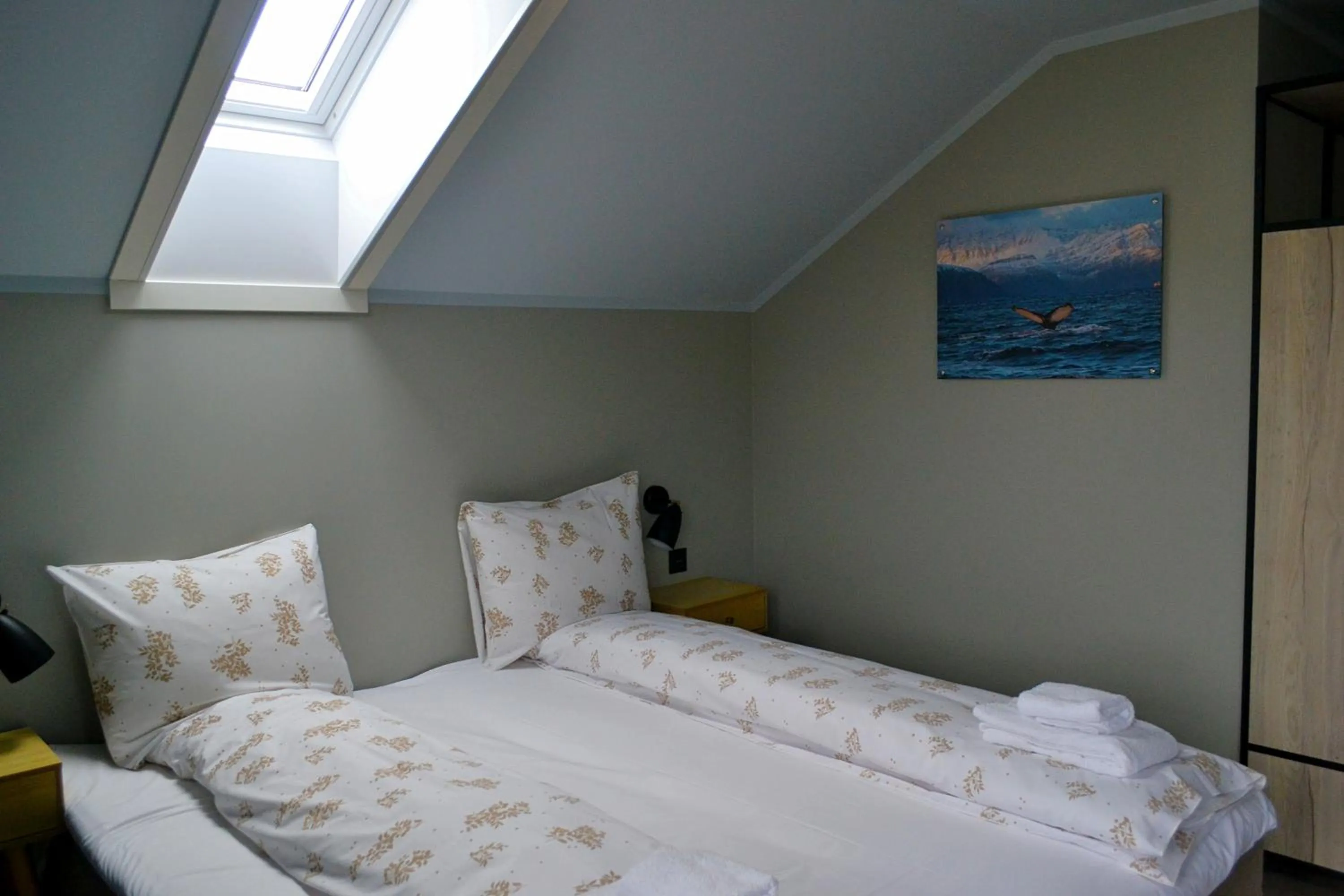 Bed in Andenes Suitehotel