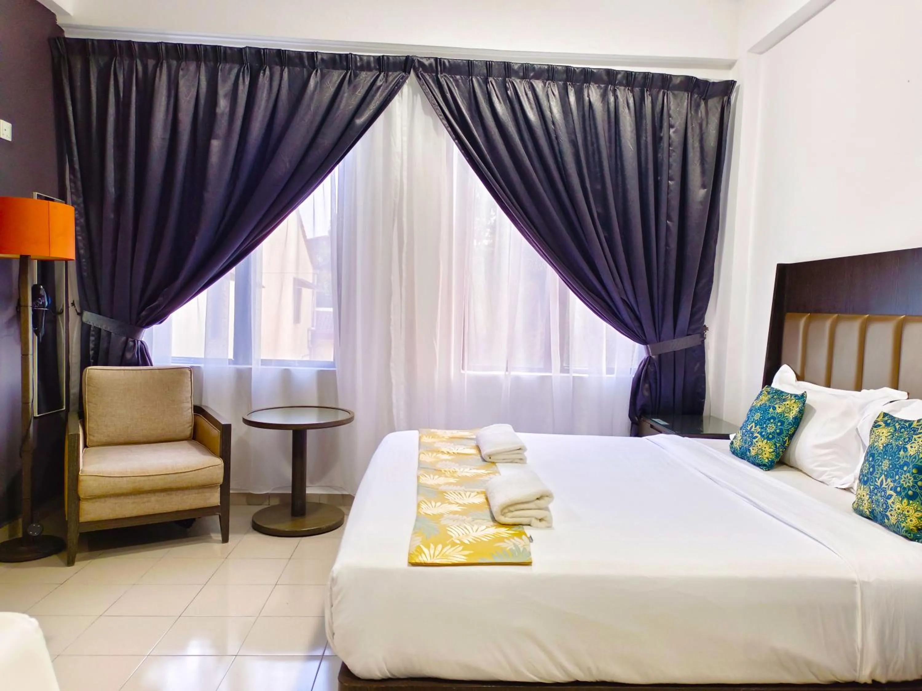Bed in Salaam Suites Hotel