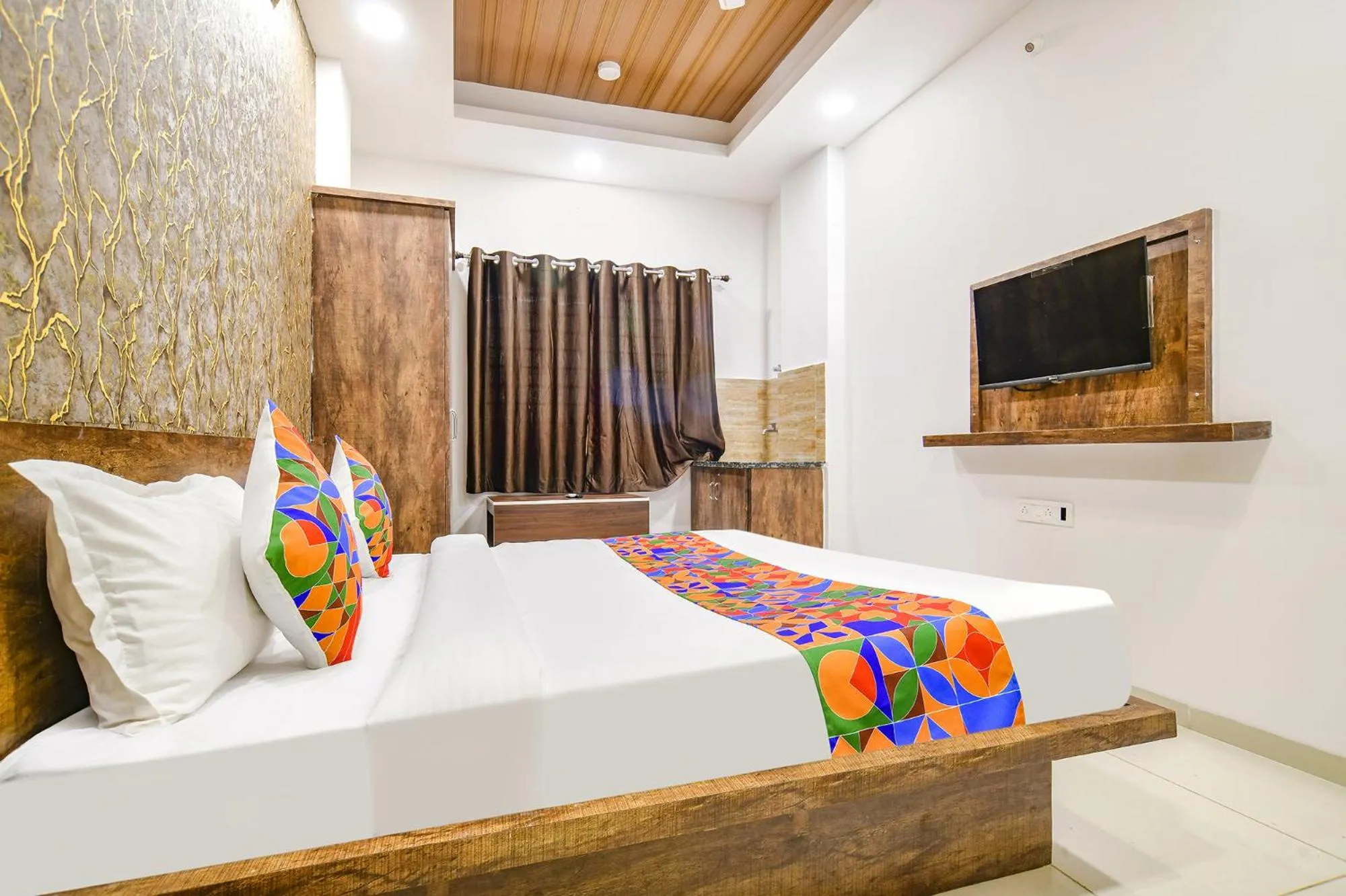 Bed in FabHotel Sage Residency