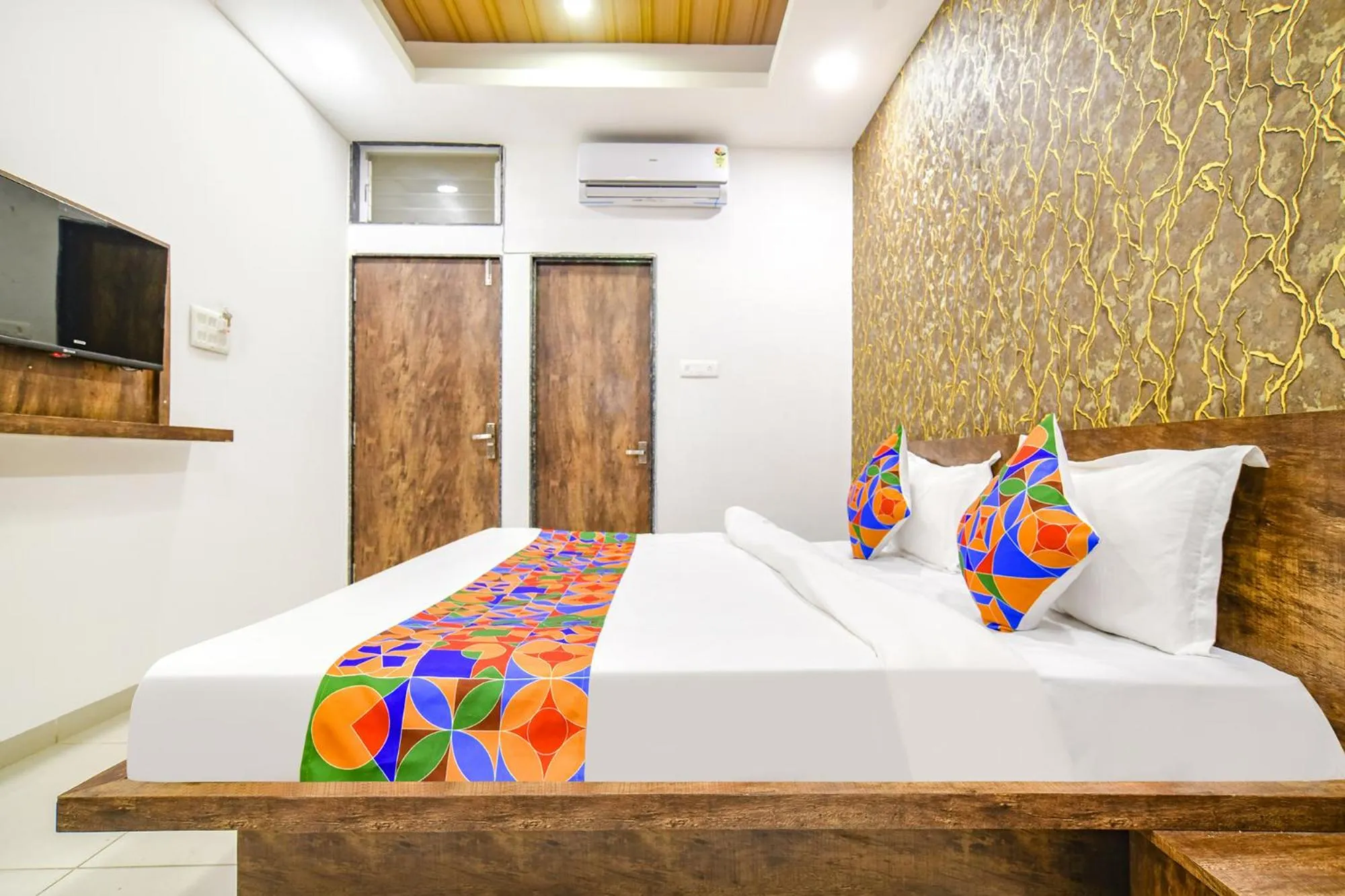 Bed in FabHotel Sage Residency