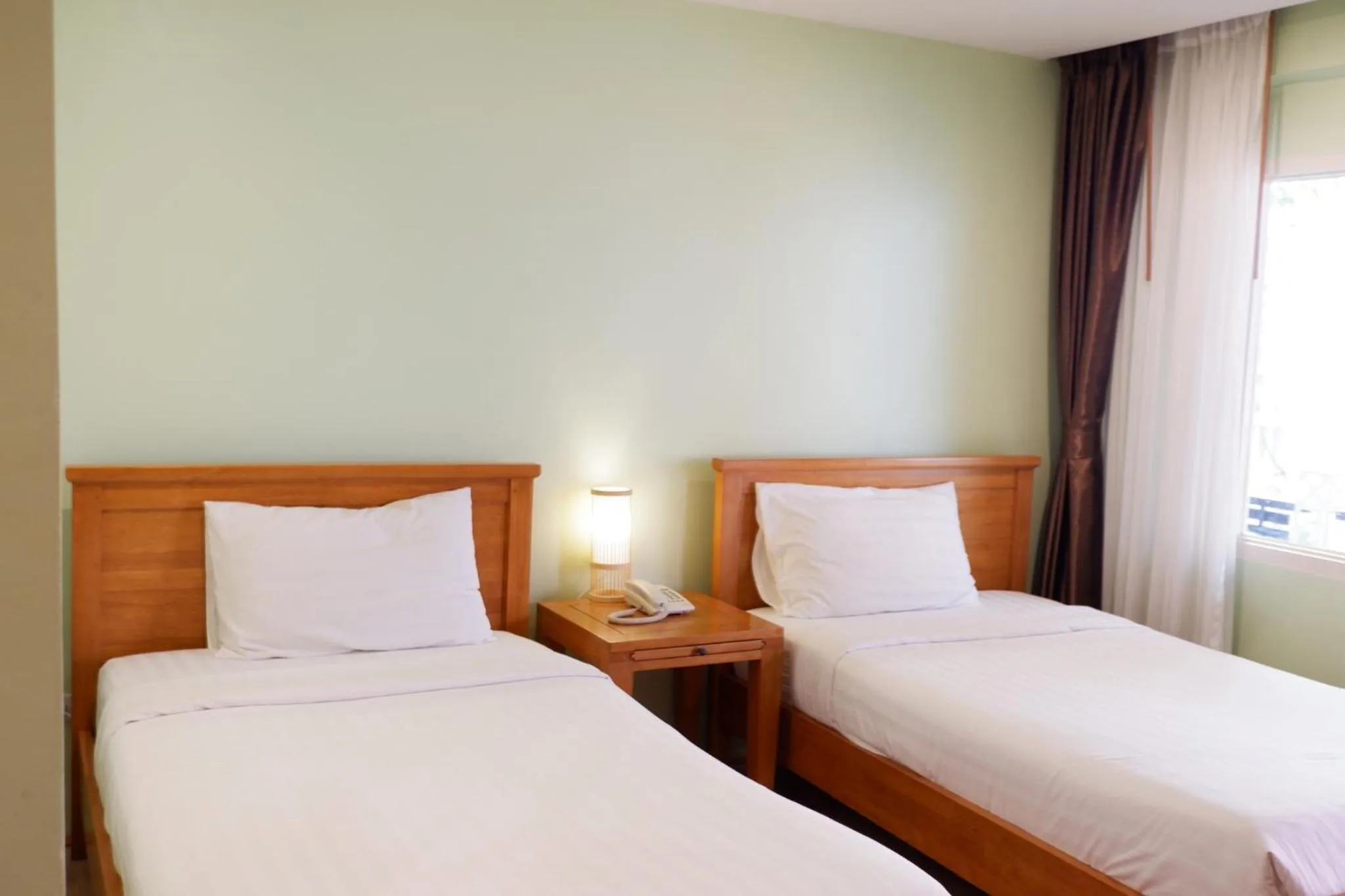 Bed in Delio Boutique Hotel