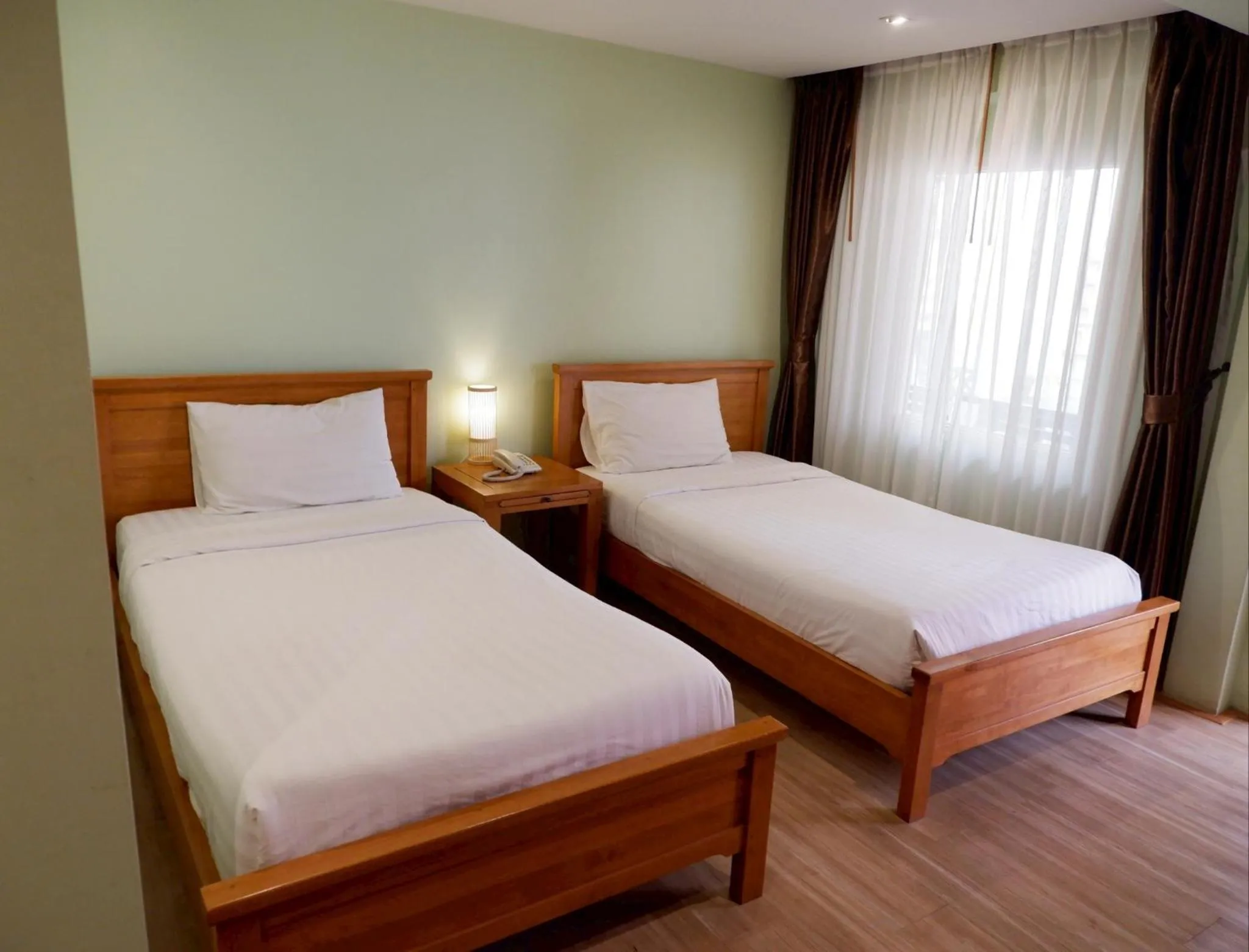 Bed in Delio Boutique Hotel