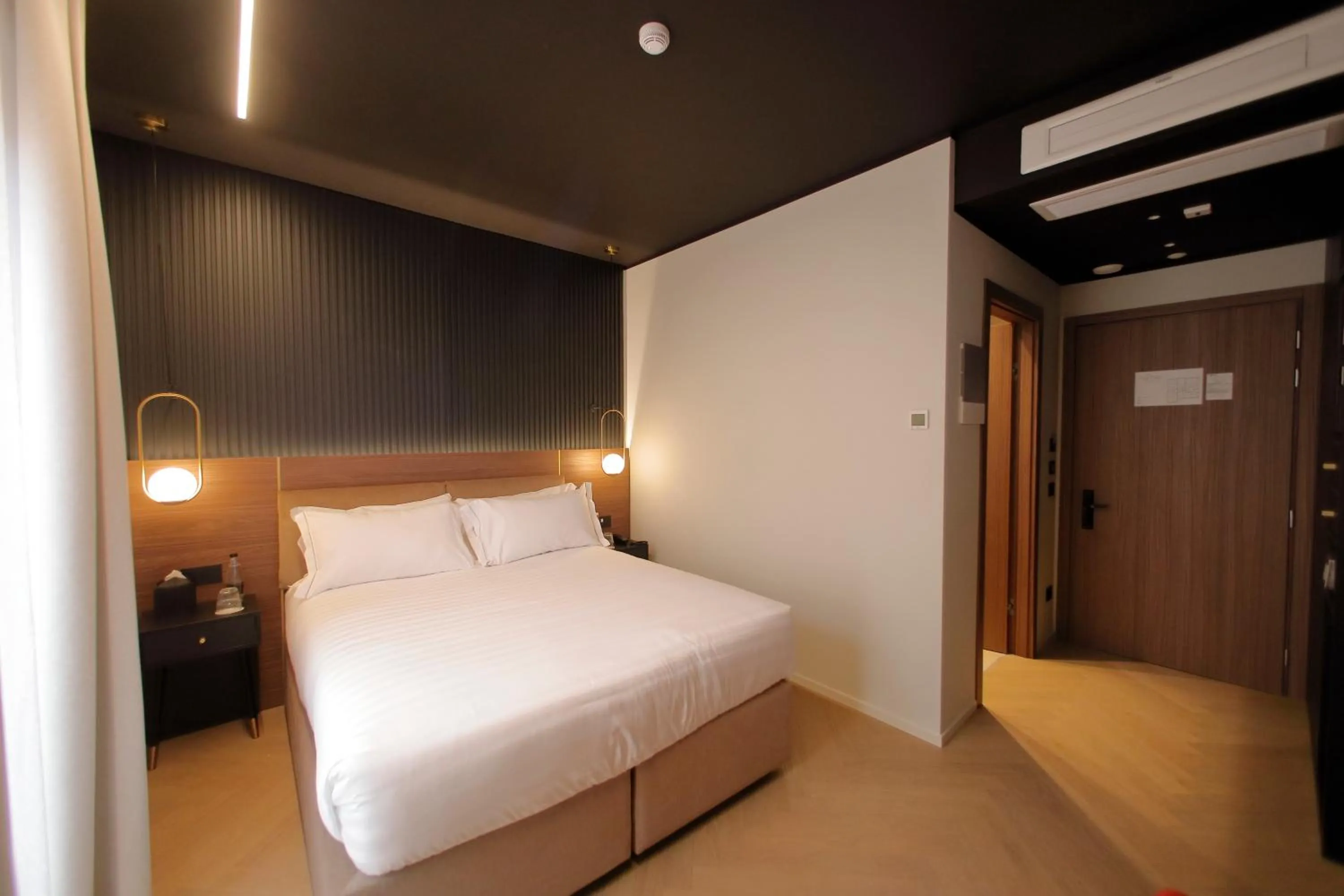 Bed in Hotel Namia by Dori