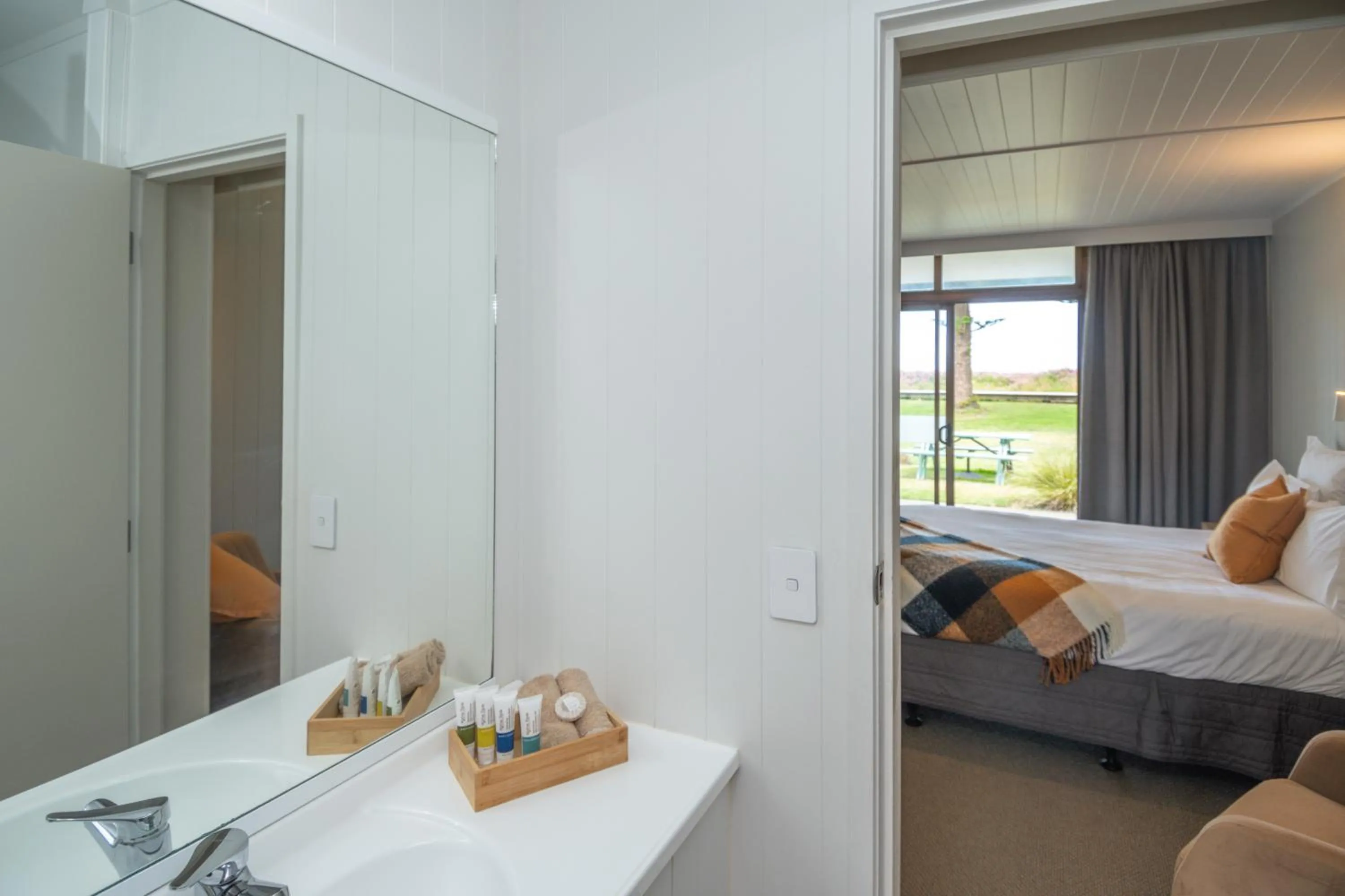 Bed in Whispering Sands Beachfront Motel