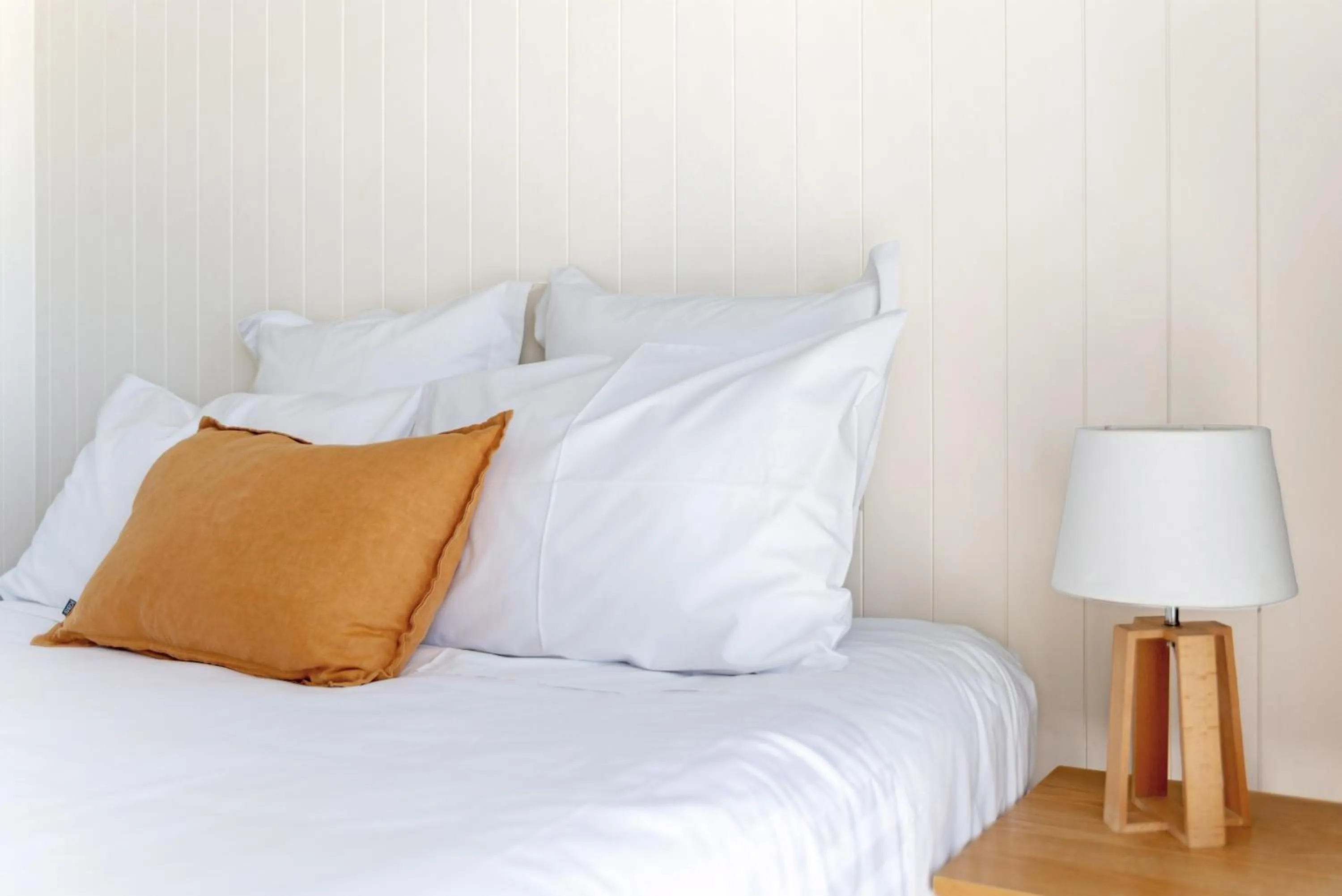 Bed in Whispering Sands Beachfront Motel