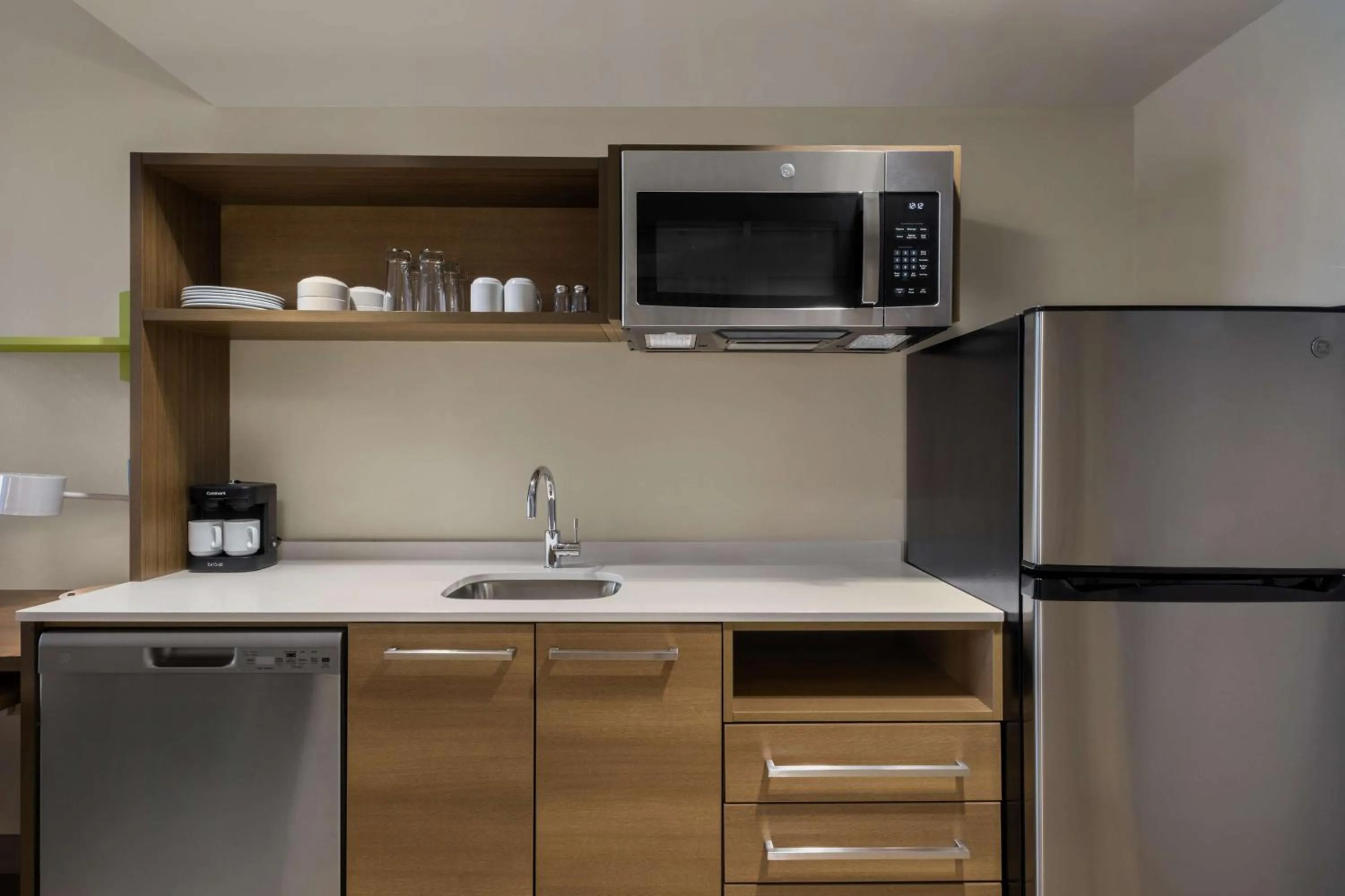 Kitchen or kitchenette in Home2 Suites By Hilton East Austin - near Downtown and UT