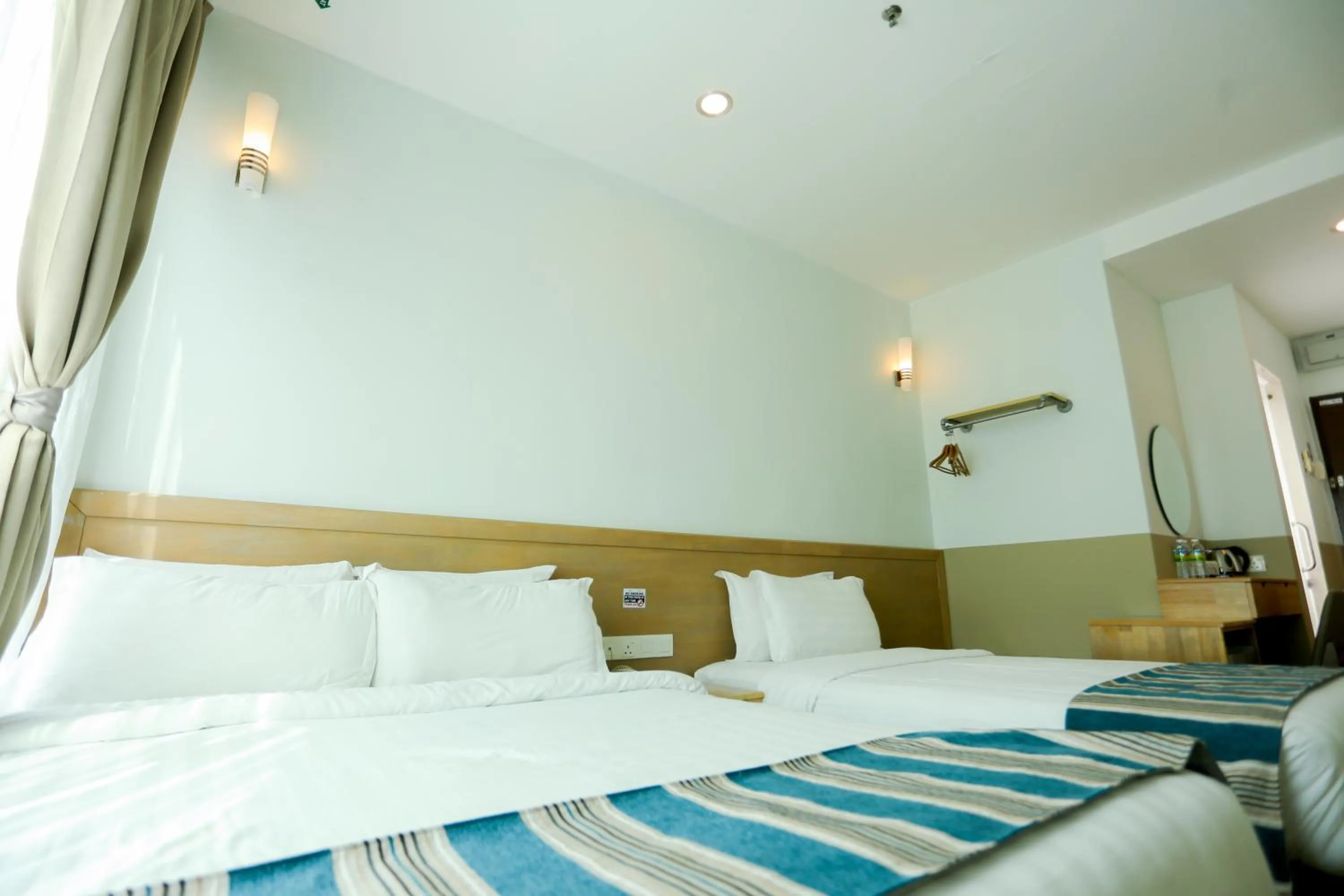 Bed in The Explorer Hotel