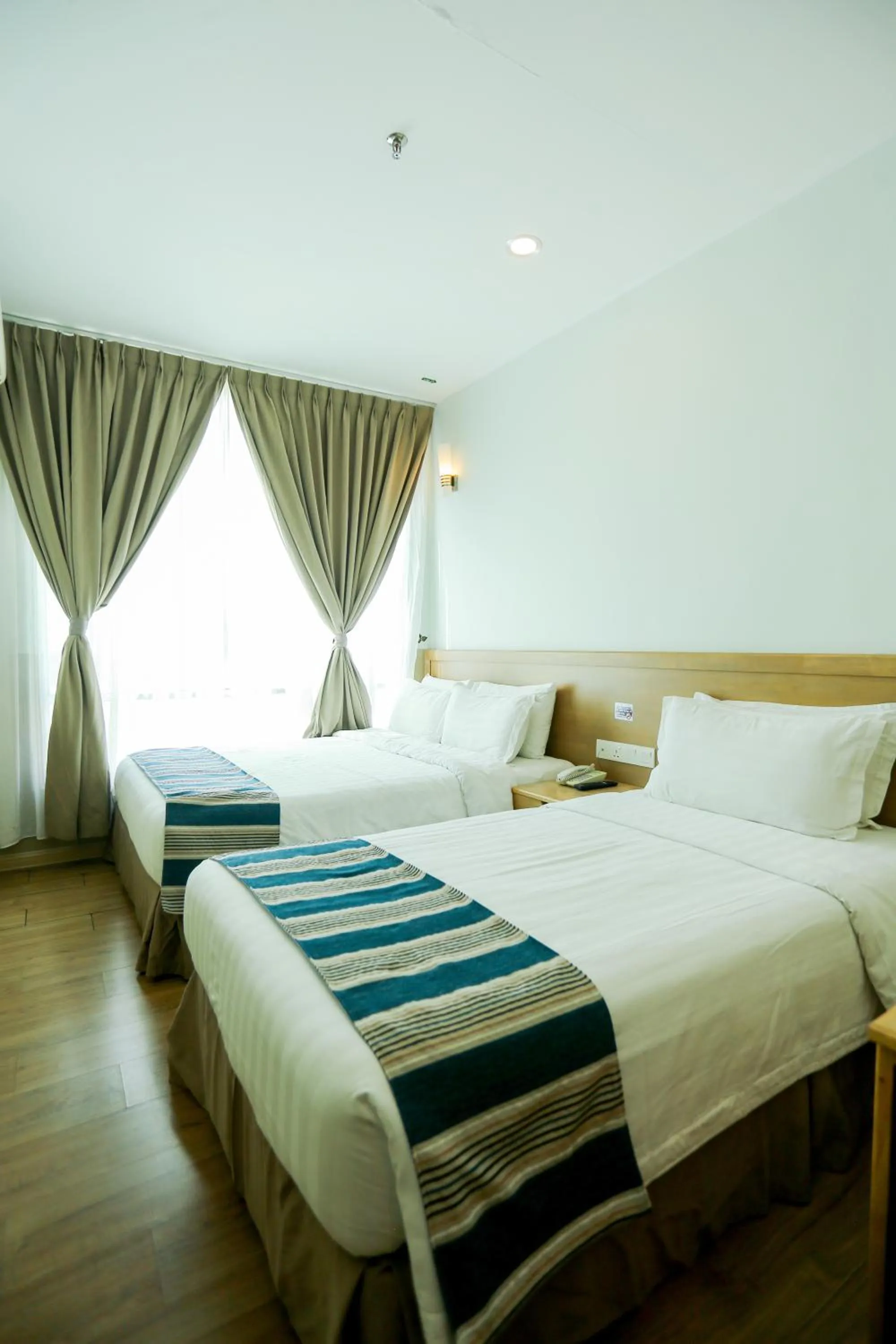 Bed in The Explorer Hotel