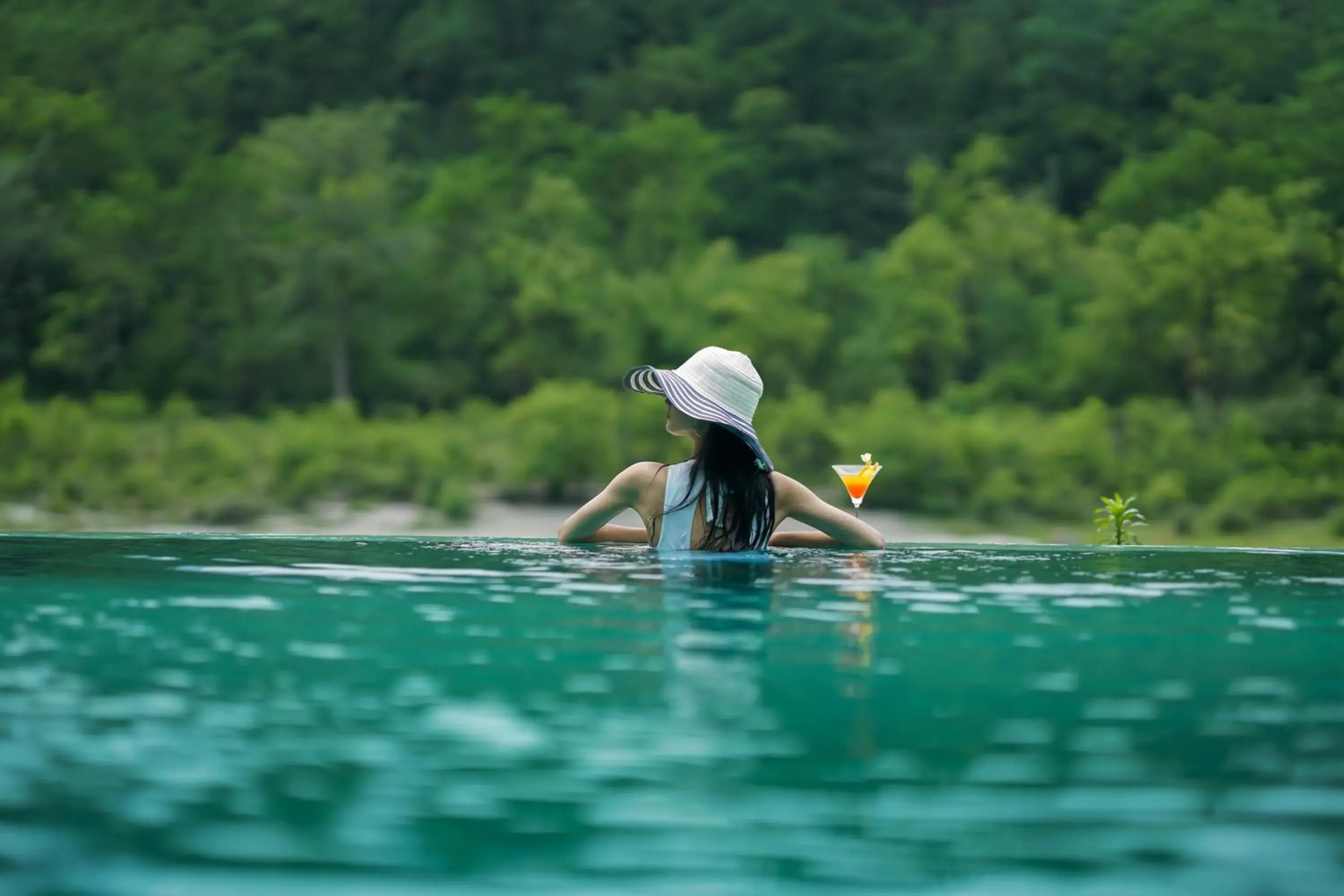 Swimming pool in Anand Kashi by the Ganges Rishikesh - IHCL Seleqtions Swimming pool in Anand Kashi by the Ganges Rishikesh - IHCL Seleqtions