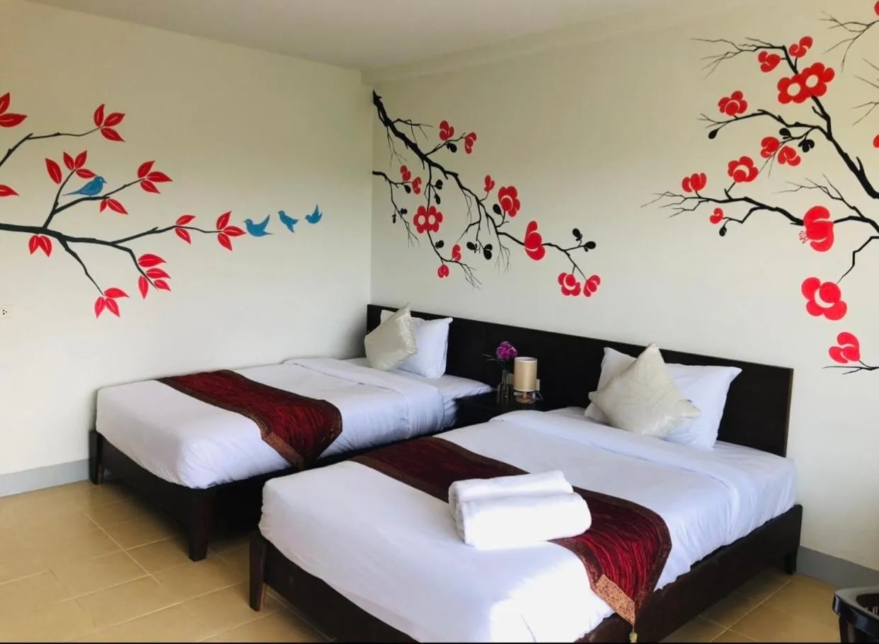 Bed in NAKA GUEST HOUSE