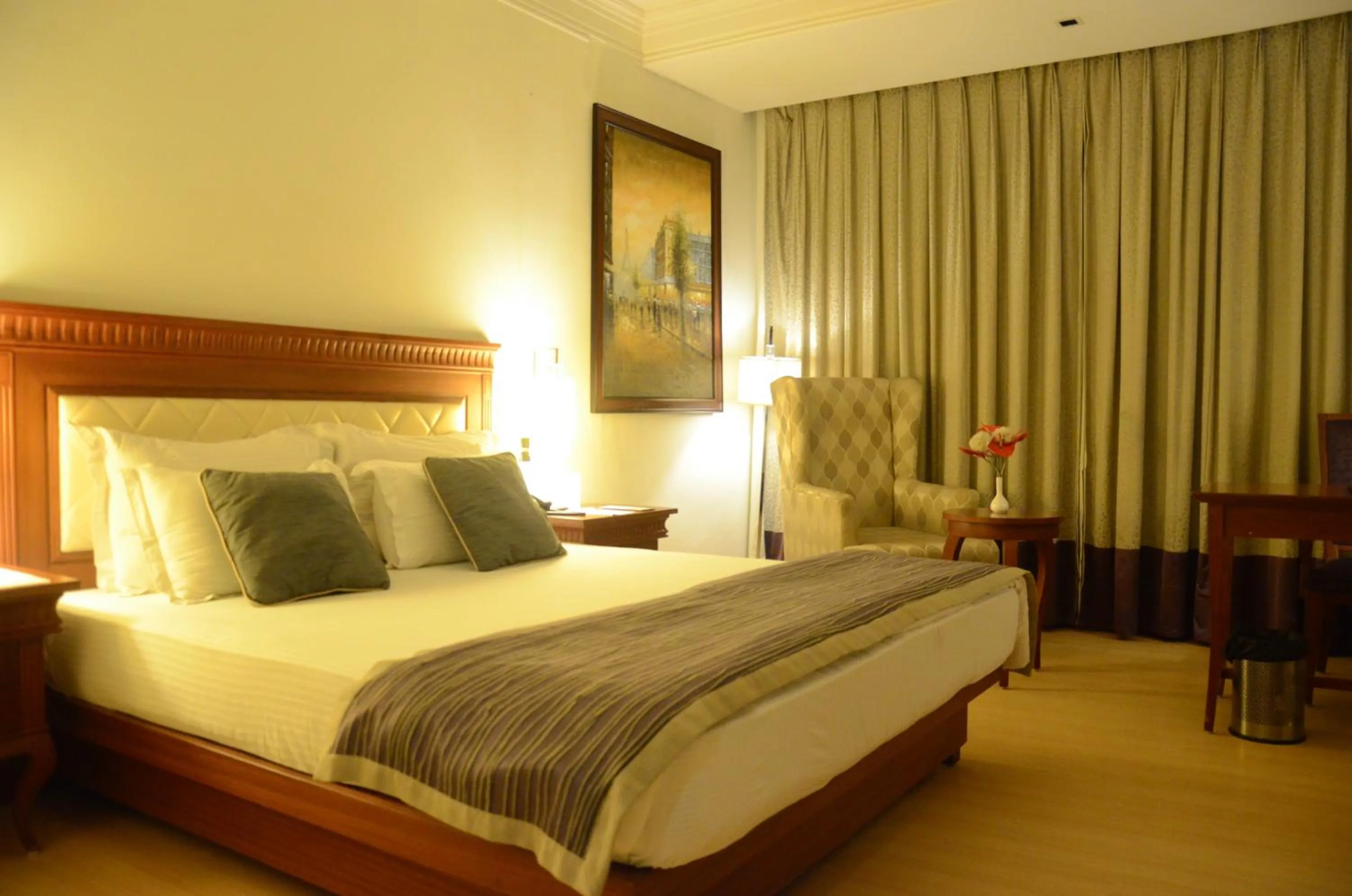 Bed in Chanakya Bnr Hotel