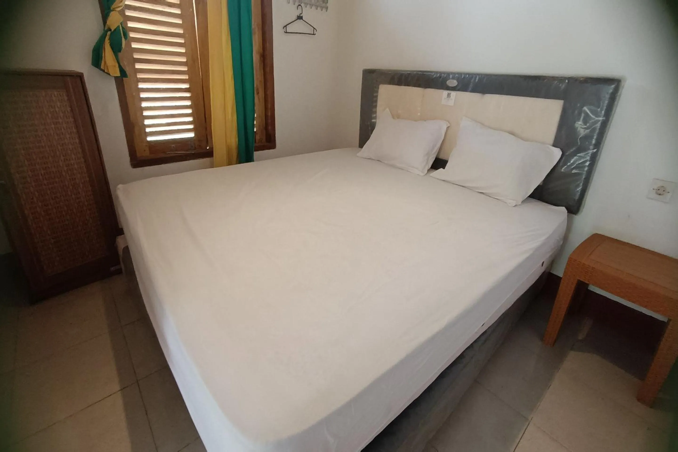 Bedroom in OYO 93626 Hi Homestay & Group