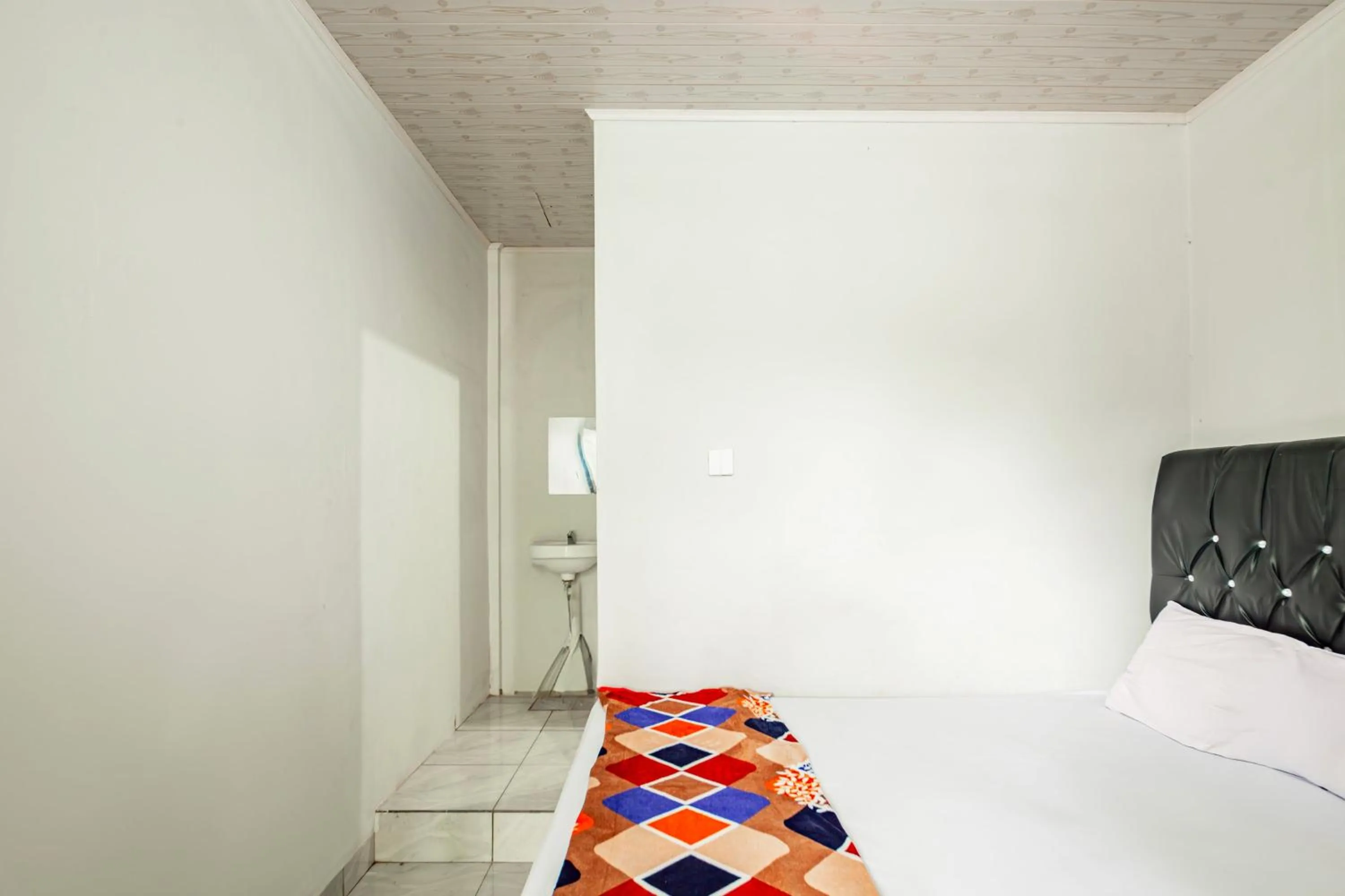 Bedroom in Hotel O Wongso Residence Syariah