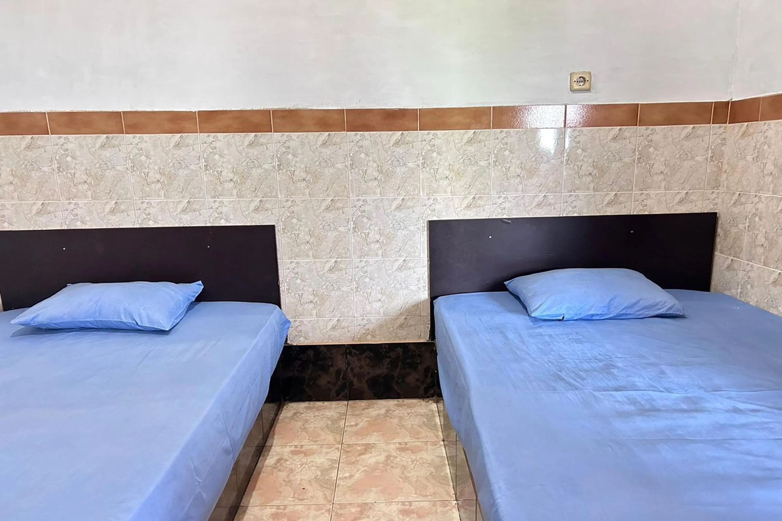 Bed in Hotel Kinasih Yogyakarta