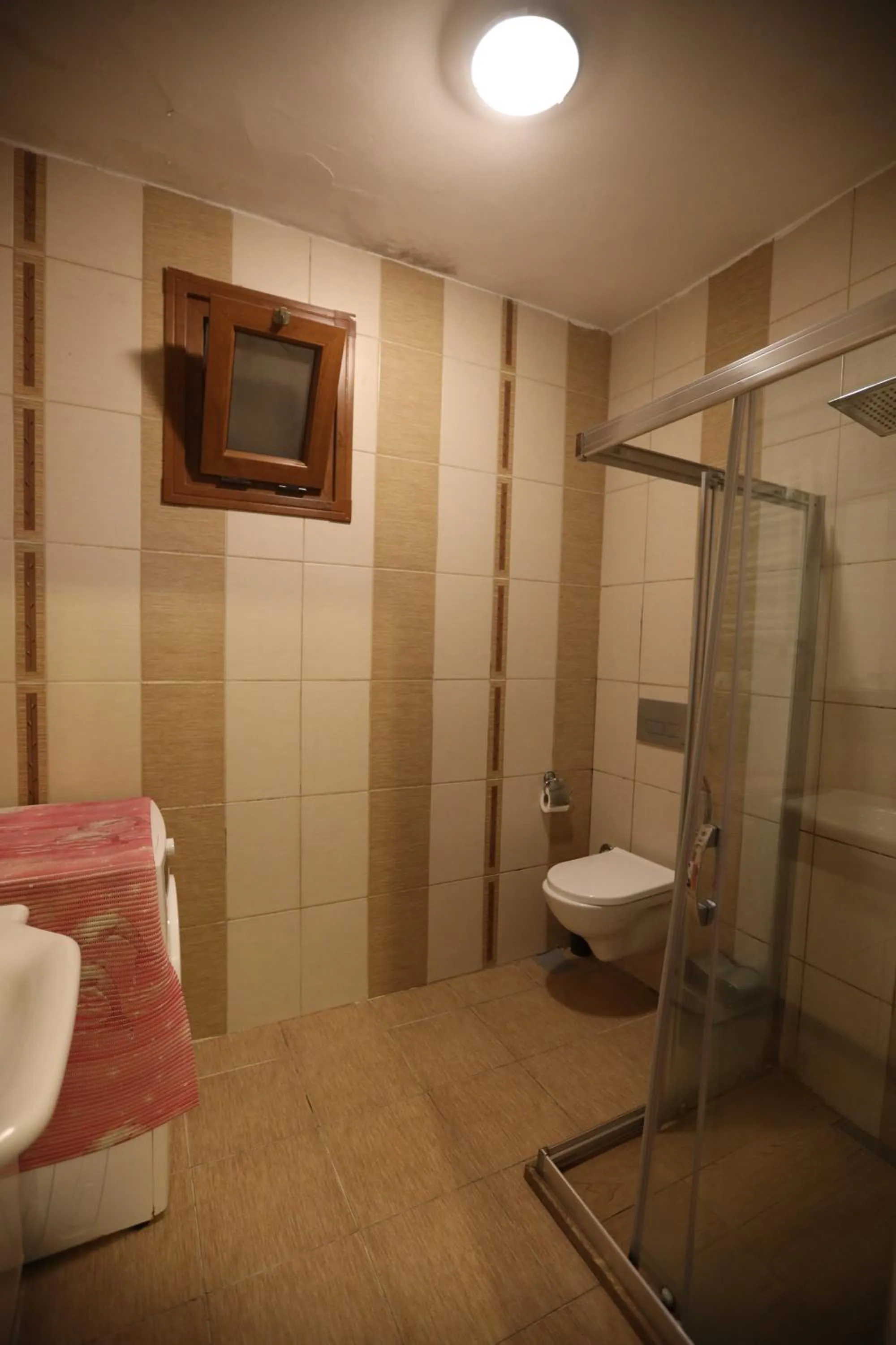 Bathroom in Zendy Suite Hotel