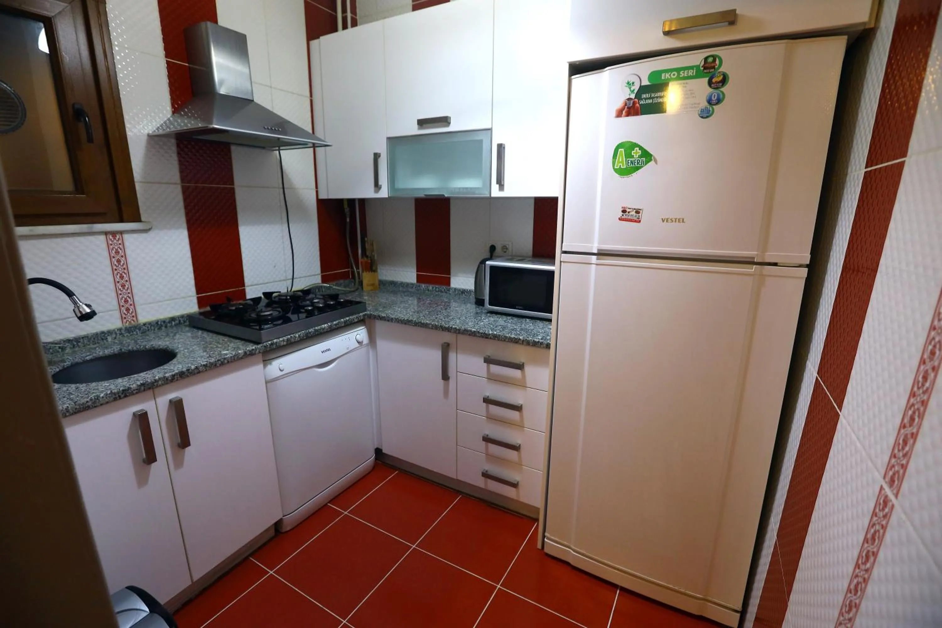 kitchen in Zendy Suite Hotel