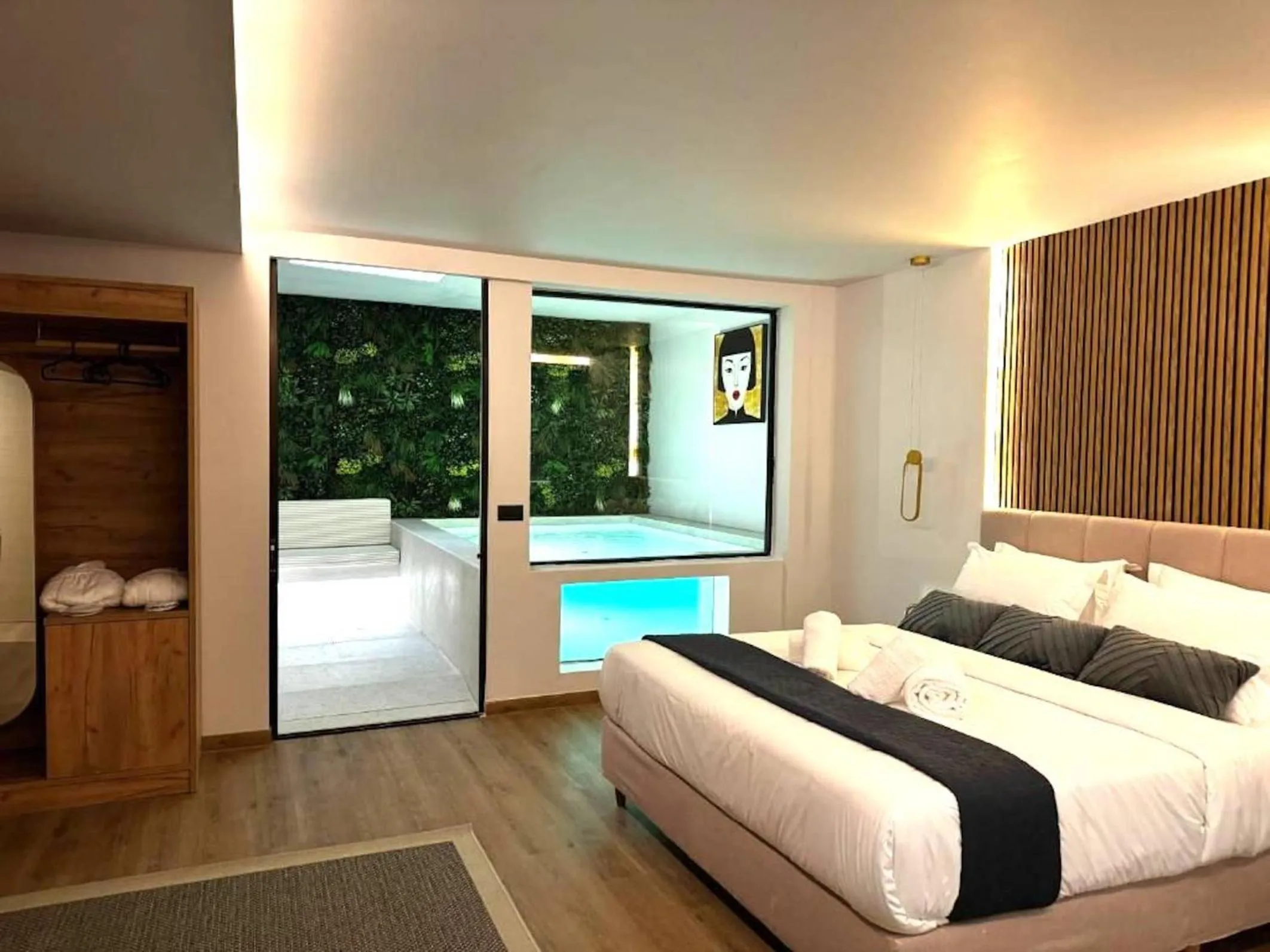 Bed in CITYLUXE Suites & Rooms