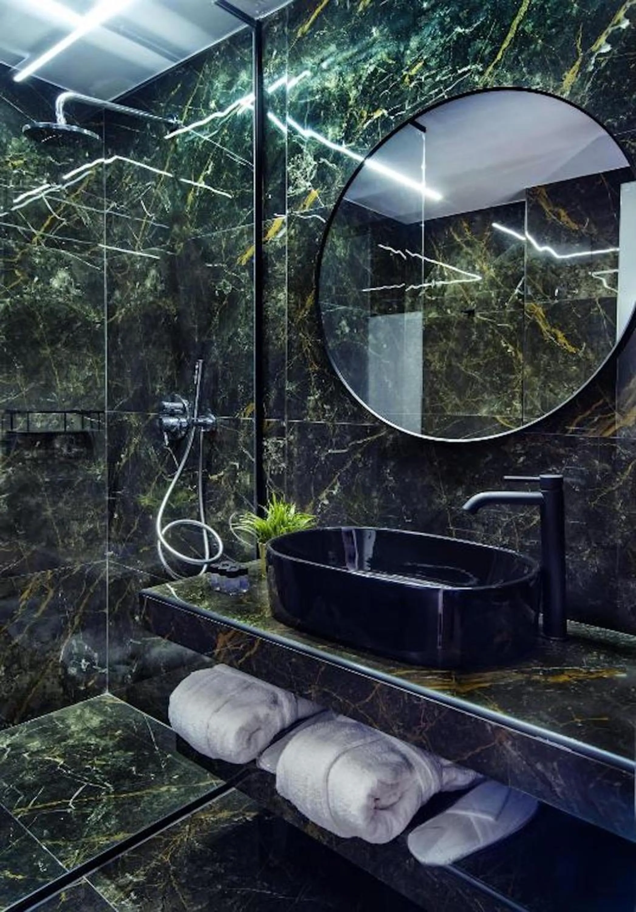 Bathroom in CITYLUXE Suites & Rooms