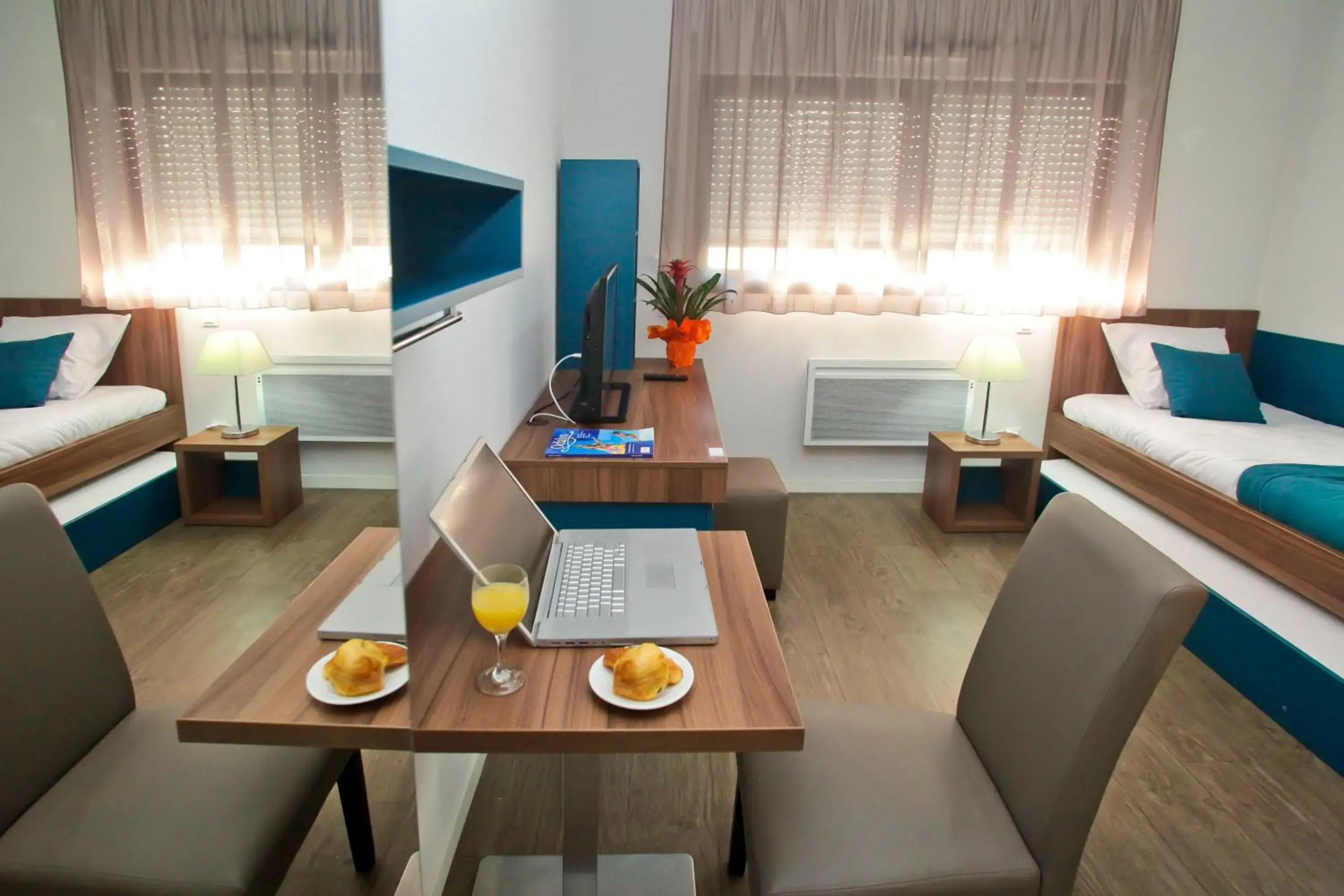 Seating area, Bed in Appart Hotel Odalys City Tours Le Jardin des Lettres Seating area, Bed in Appart Hotel Odalys City Tours Le Jardin des Lettres