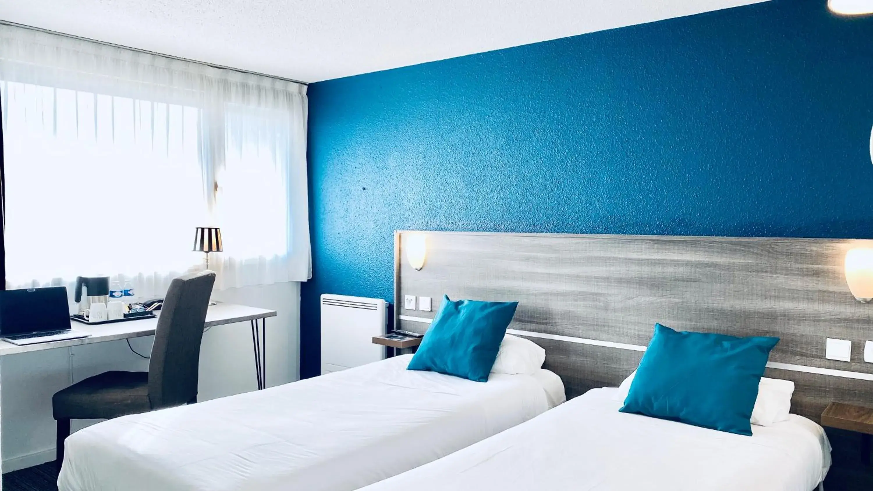 Bed in Hôtel Restaurant Kyriad de Péronne Bed in Hôtel Restaurant Kyriad de Péronne