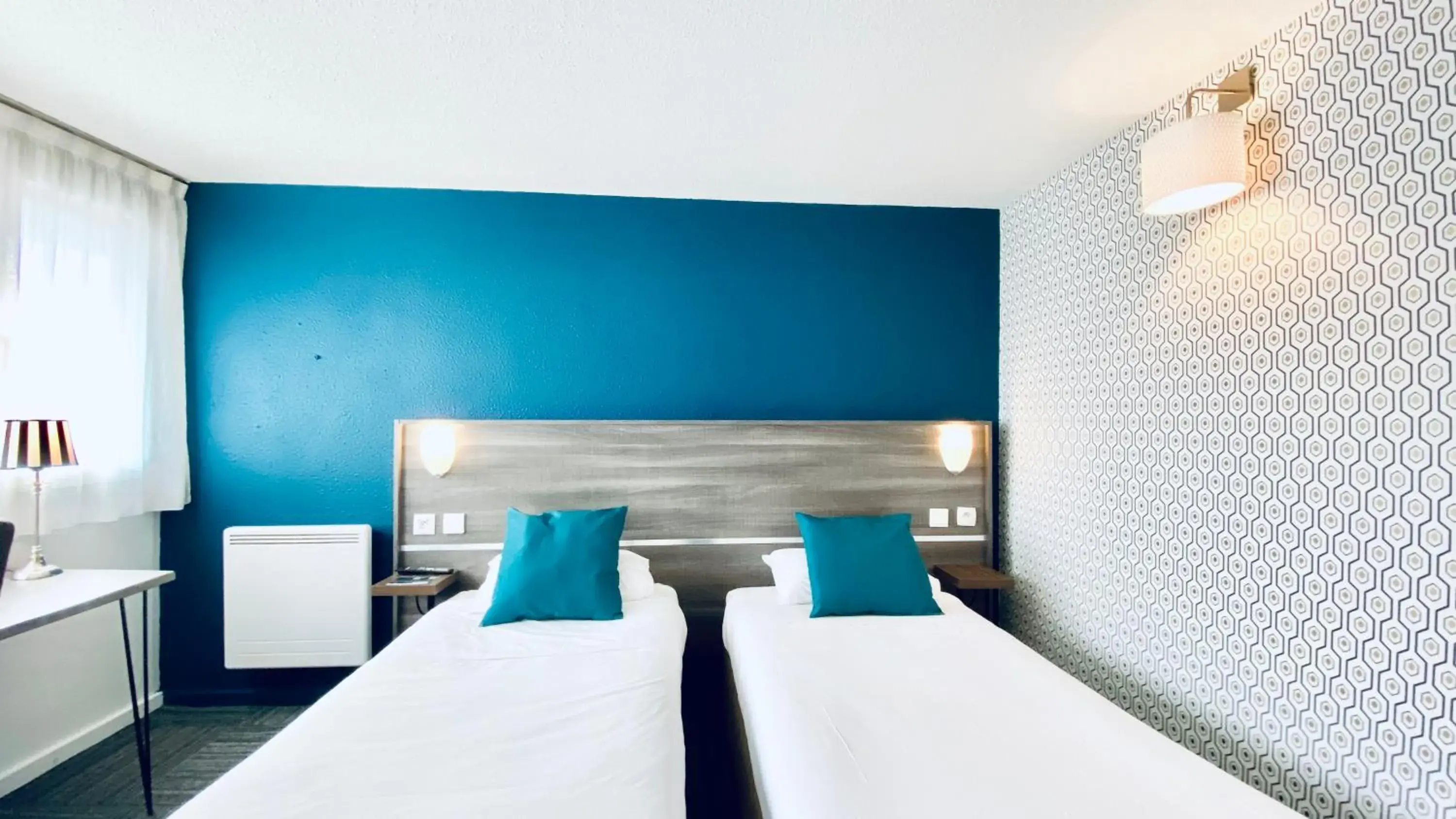 Bed in Hôtel Restaurant Kyriad de Péronne Bed in Hôtel Restaurant Kyriad de Péronne