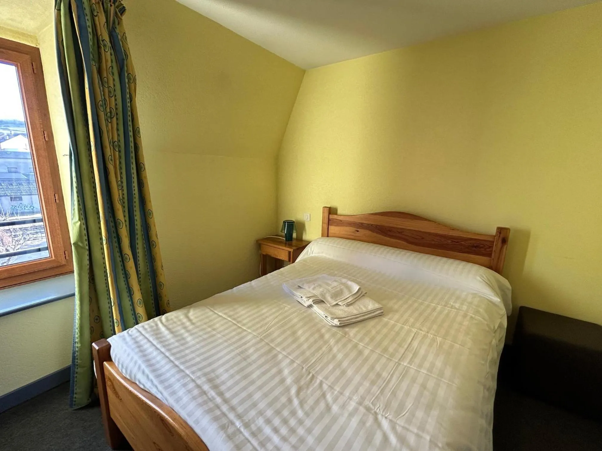 Bed in AUX GLOBE-TROTTERS