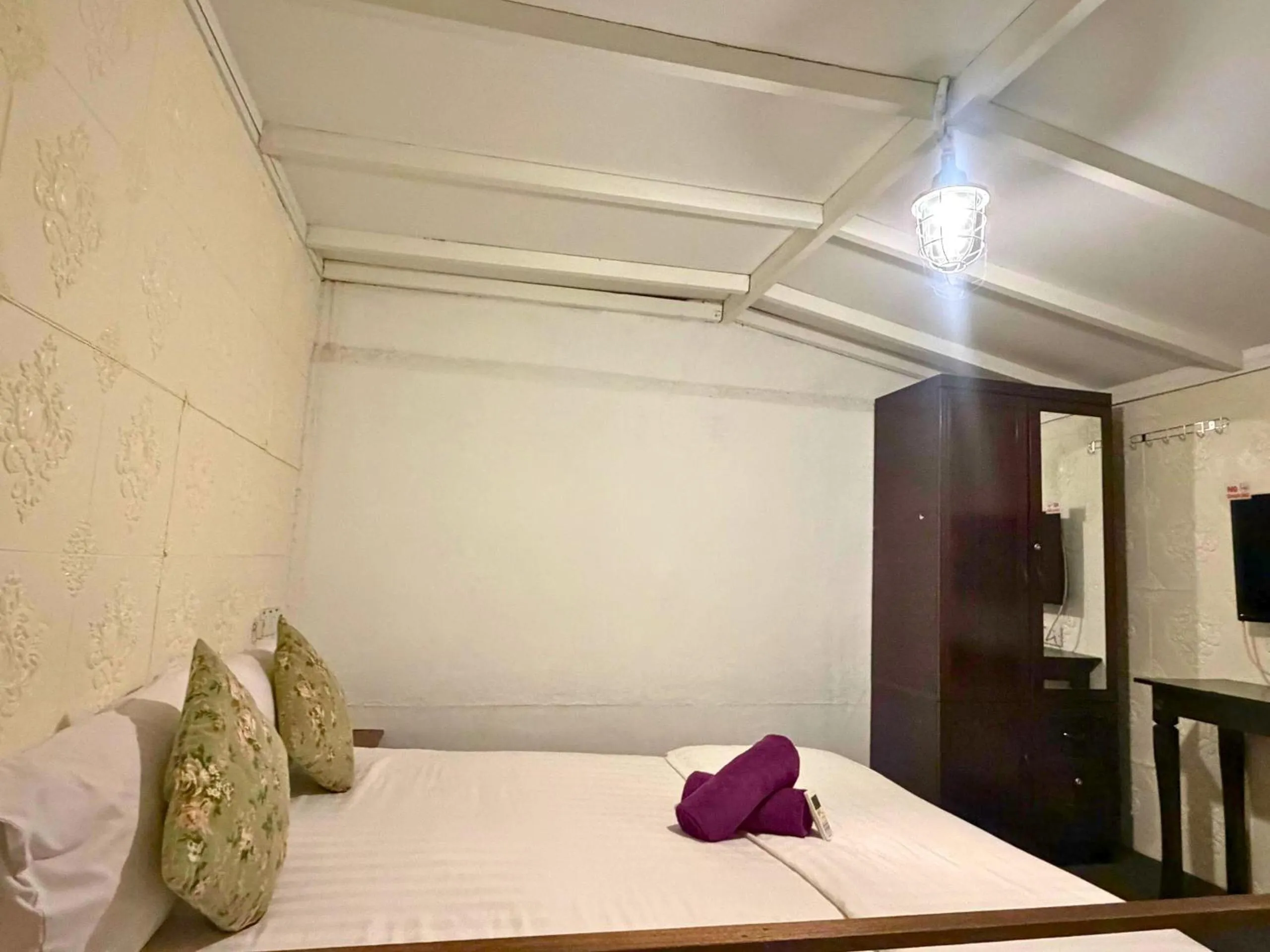 Bed in Dou Houz Georgetown