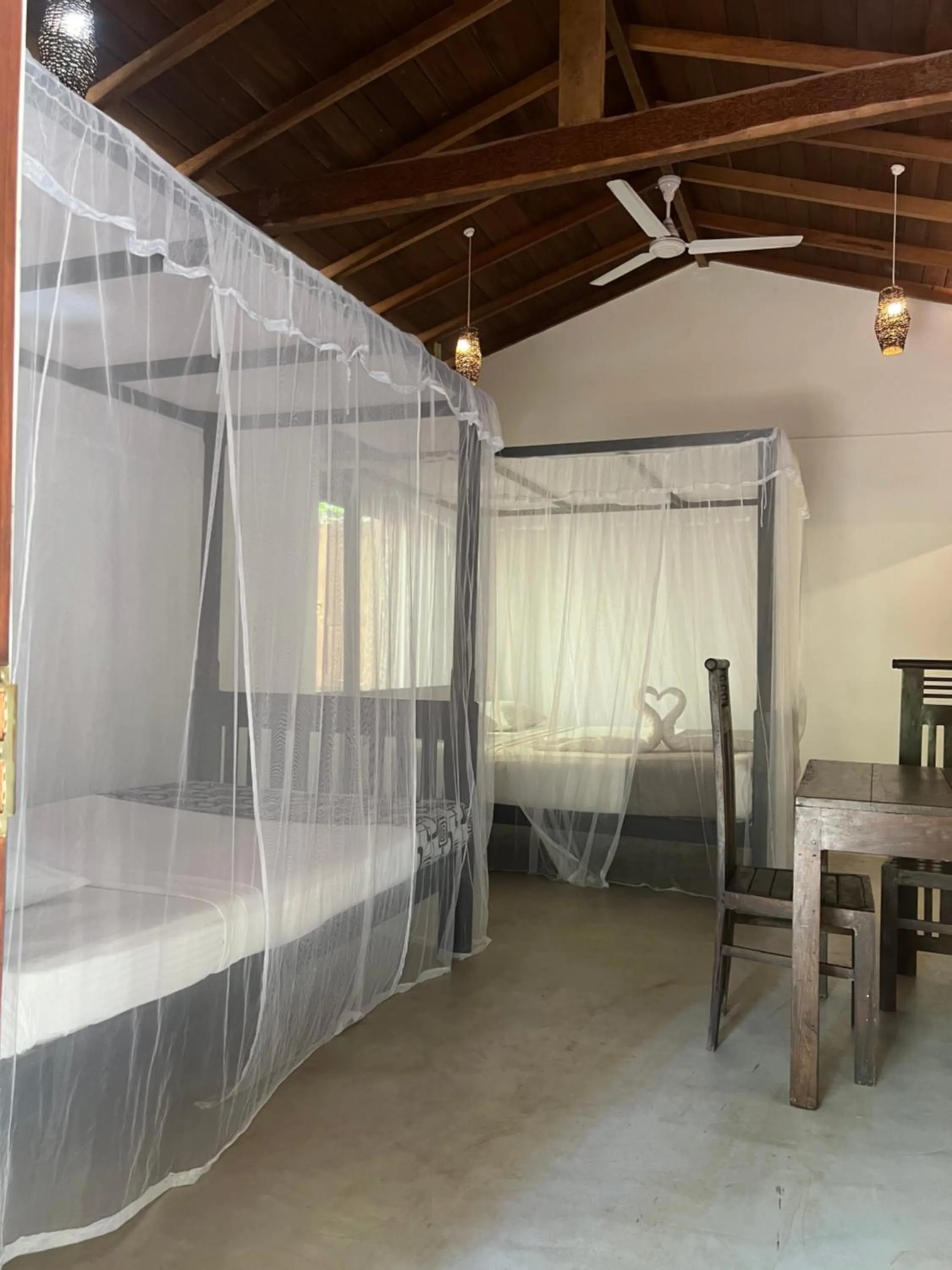 Bed in Ganesh Garden Beach Cabanas