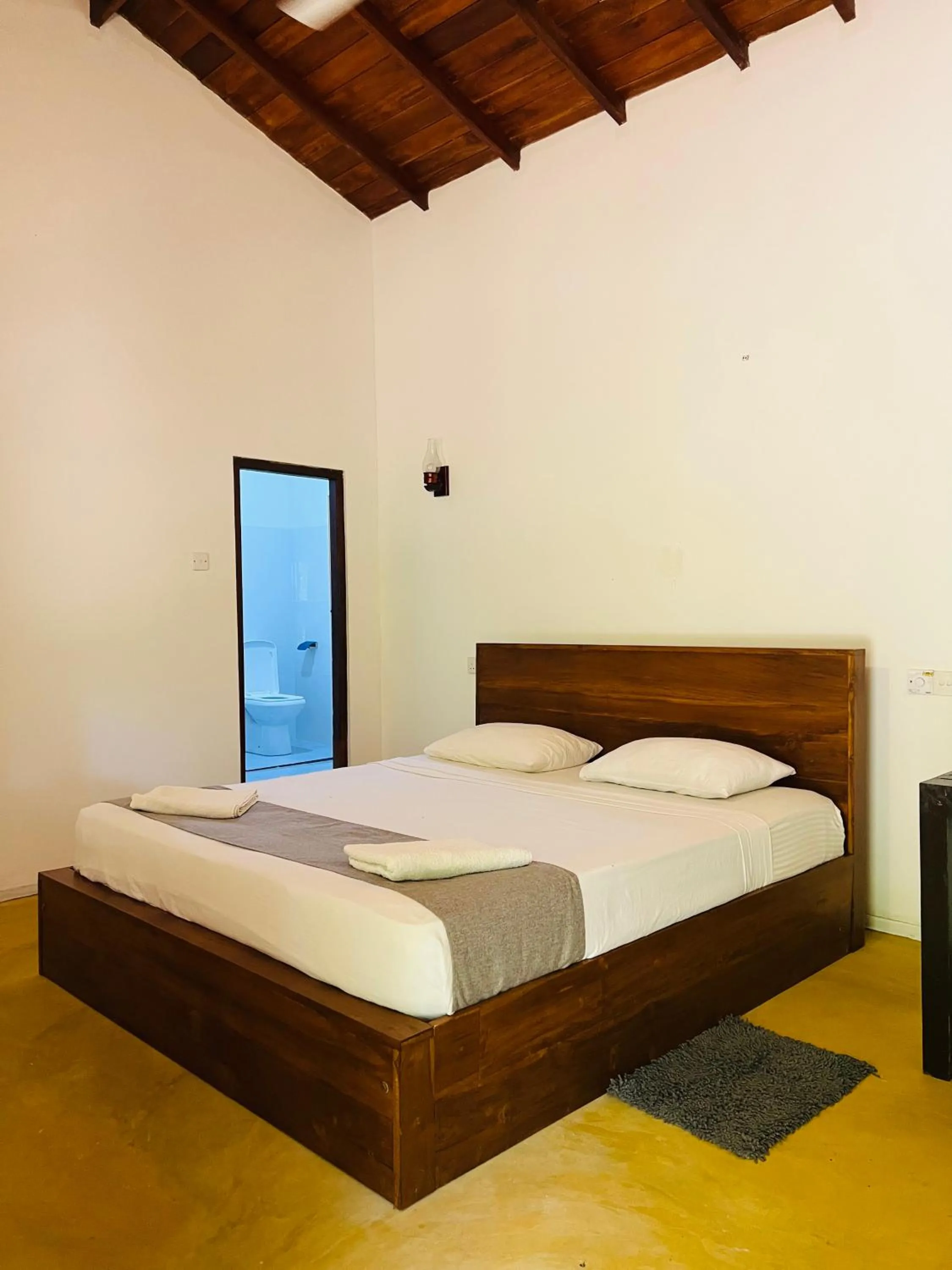 Bed in Ganesh Garden Beach Cabanas