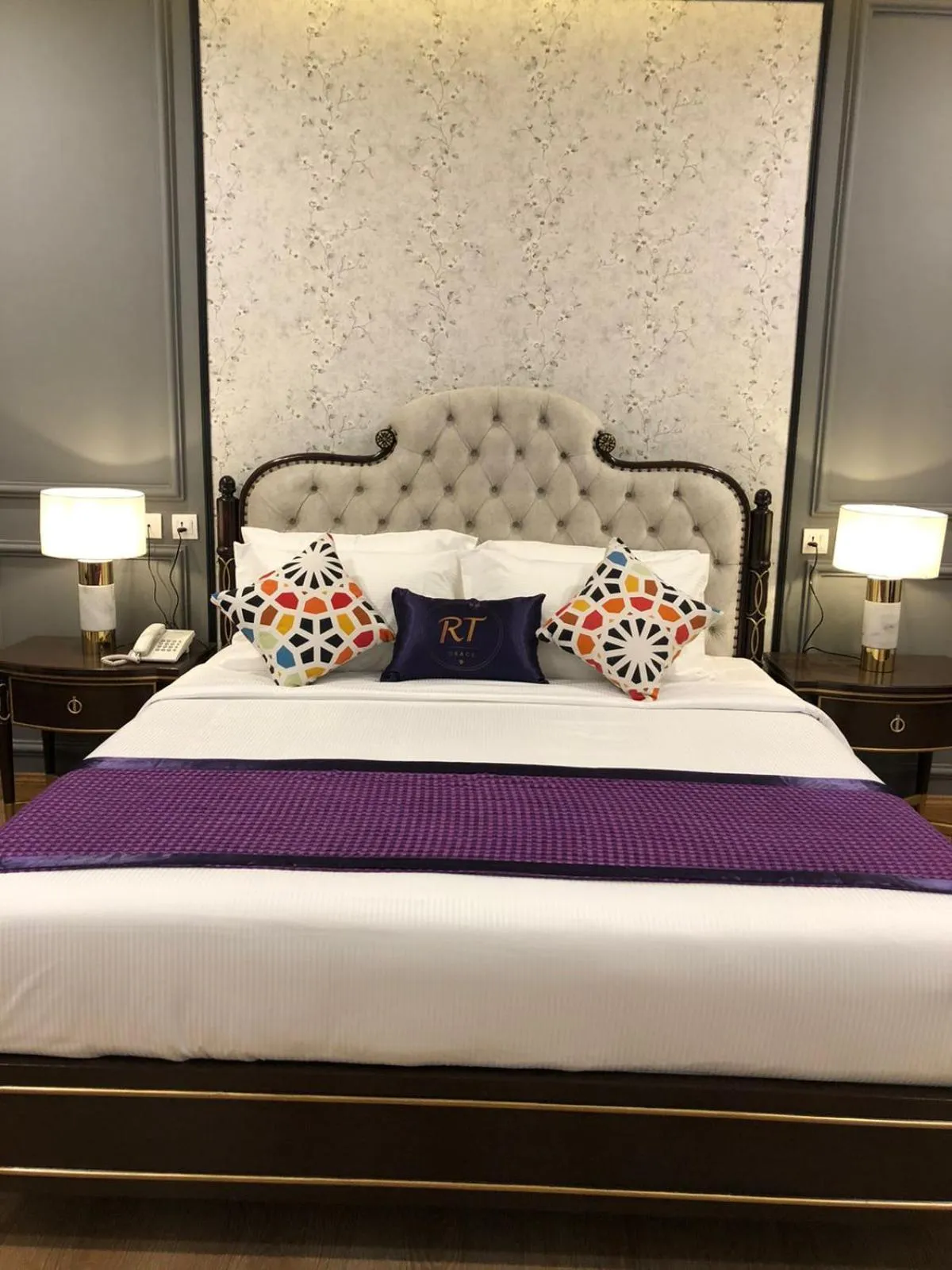 Bed in RT Grace Royal Taj Hotel Sukkur
