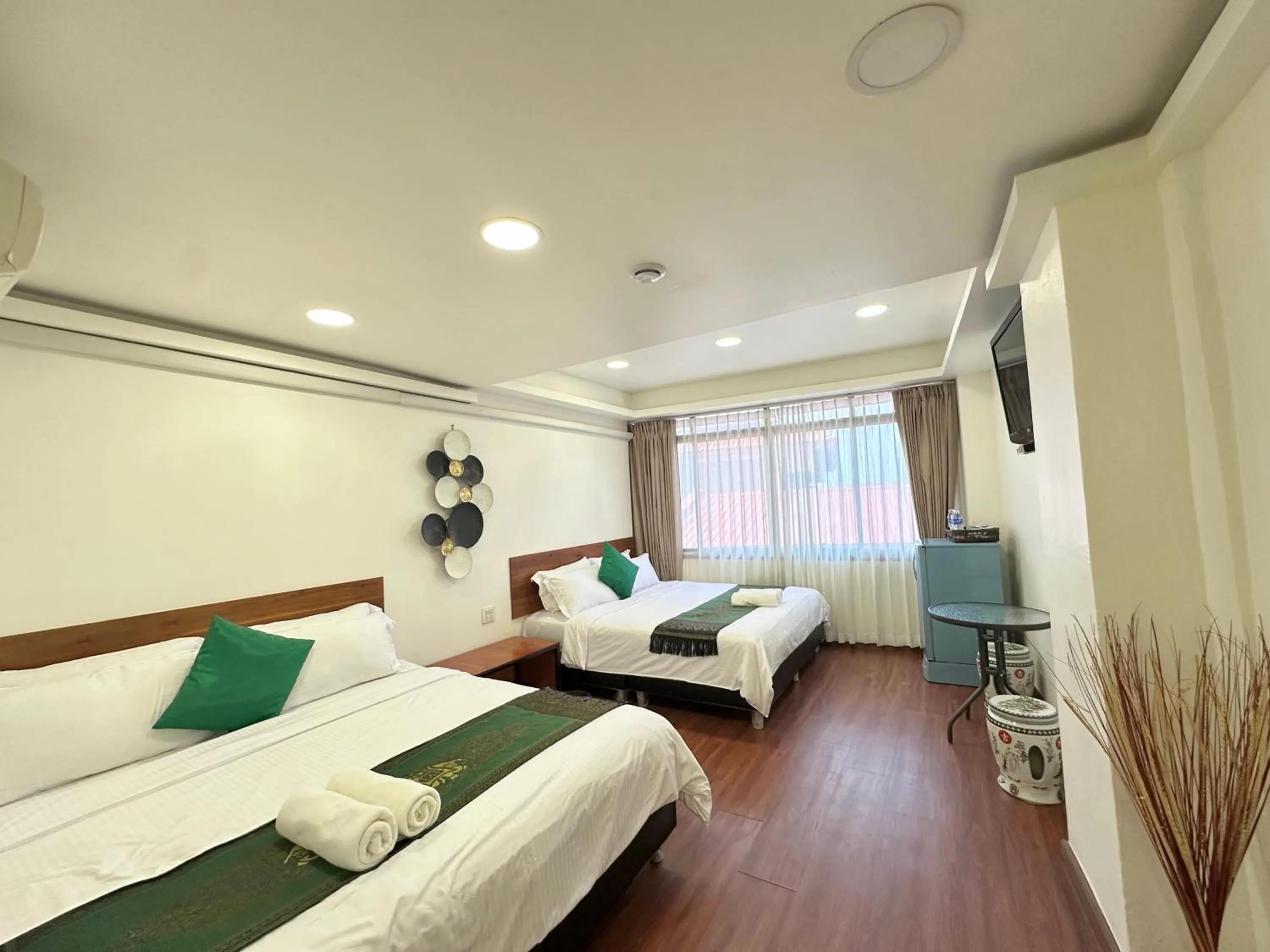 Communal lounge/ TV room, Bed in Longzhu Guesthouse